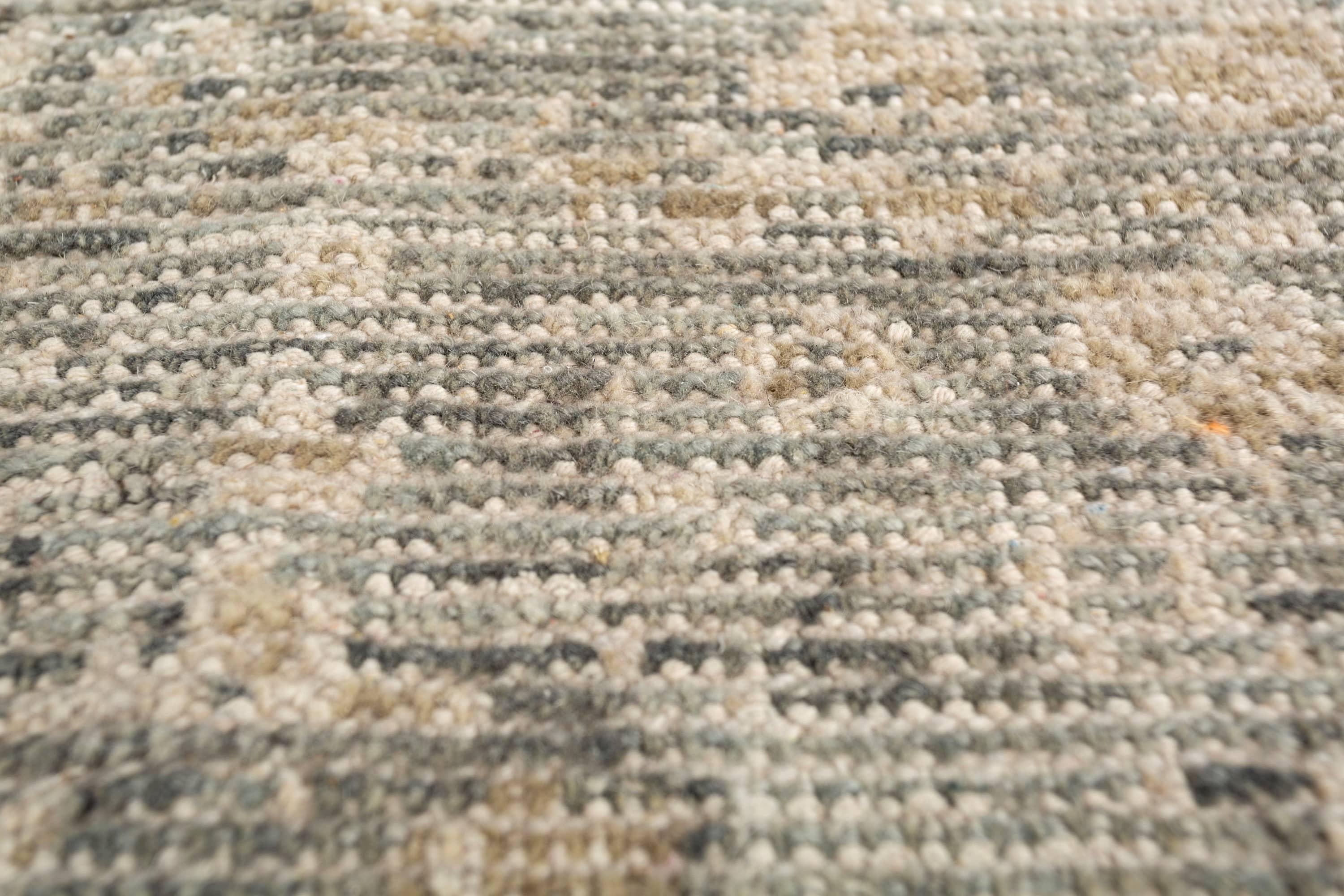 Add a touch of elegance with this 10' x 14' Jaipur wool rug, featuring a soothing palette of ashley blue and blue haze. Hand-knotted by skilled artisans, this rug showcases a timeless floral motif, blending traditional and transitional design
