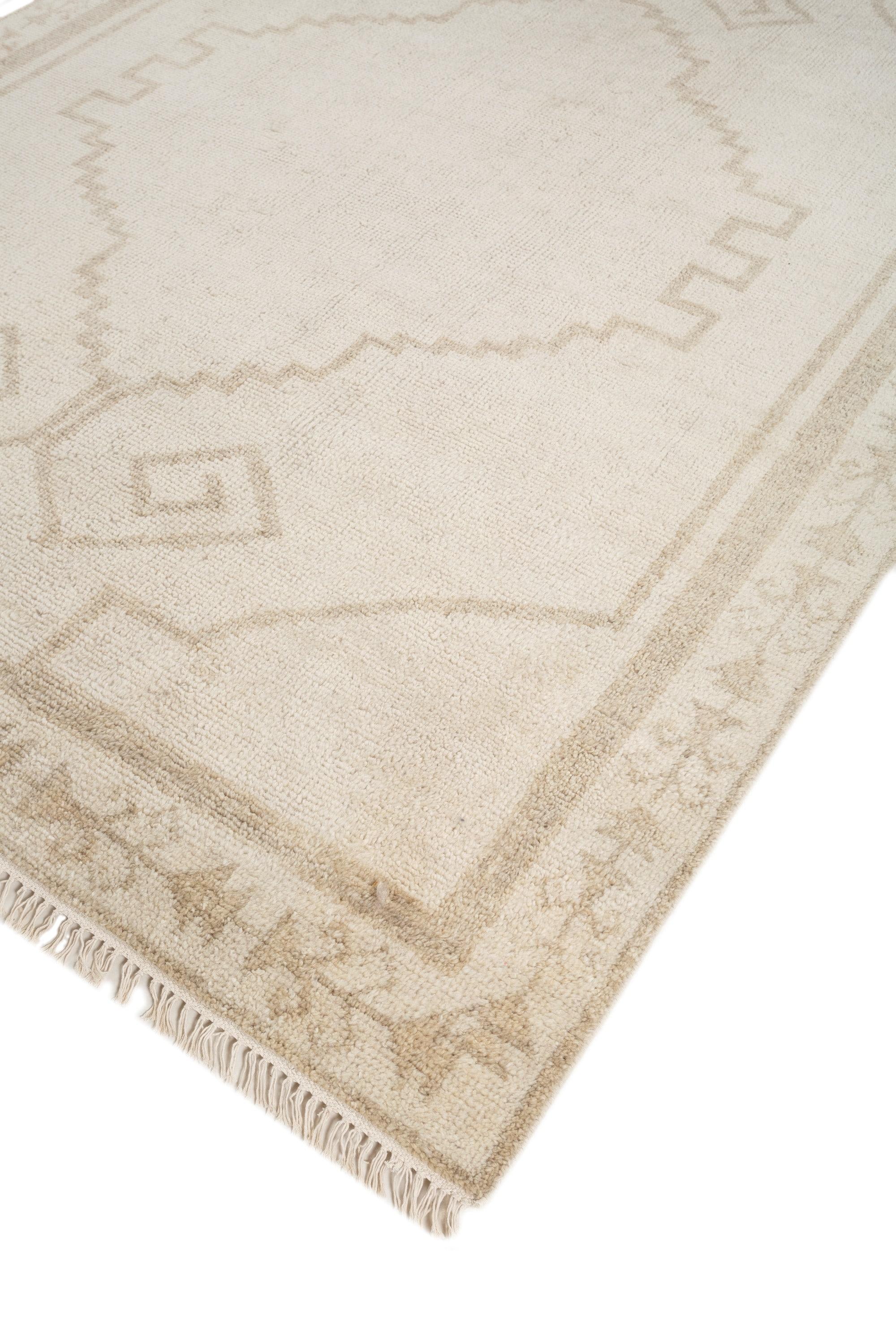 This 6' x 9' hand-knotted rug from Jaipur Rugs features a serene blend of white ice and driftwood tones, creating an elegant, calming atmosphere. Made from a luxurious blend of high-quality wool, the rug offers a soft, lustrous texture and a subtle
