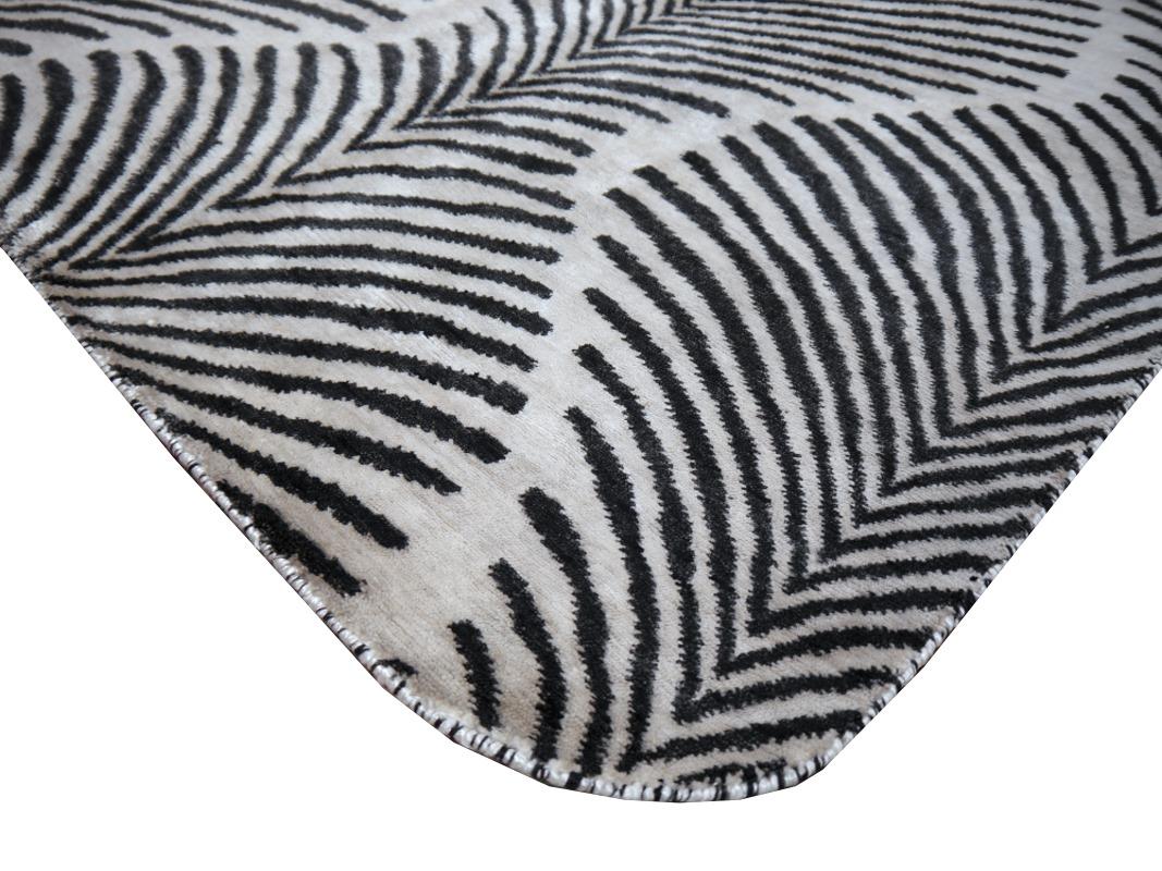 A Zebra design rug, contemporary production, in style of Art Deco, hand knotted, using finest hand spun Bamboo Silk.

This  hand knotted Zebra Hide Design Rug has the Art Deco touch. Animal print designs were on Vouge in the 1920´s and still bring