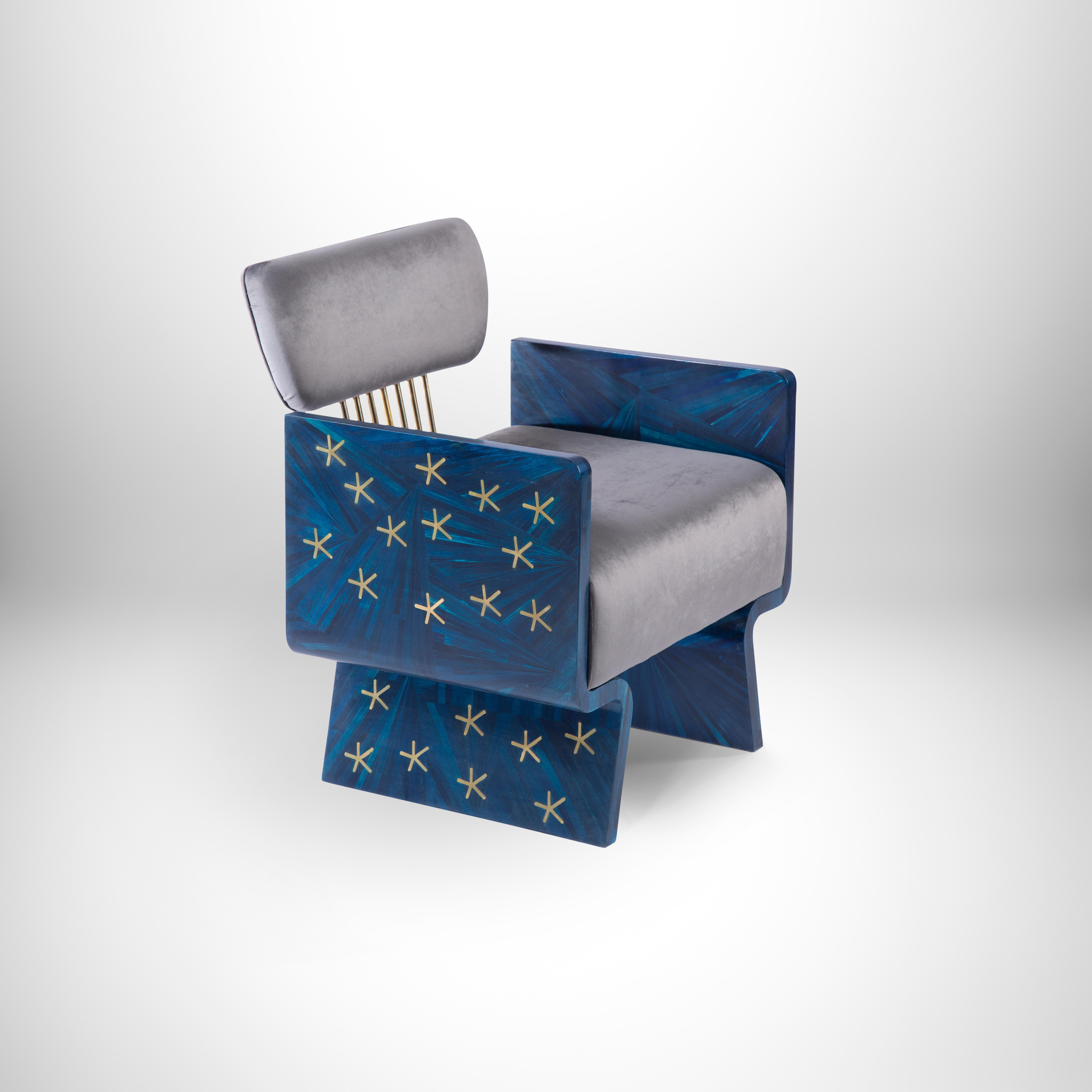 Hand-laid brass stars on blue straw. Nut-inspired armchair with velvet cushion.
Inspired by Nut, the Egyptian celestial goddess of the sky. The brass stars glimmer, contrasting against the deep blue straw highlighting the striking beauty of this