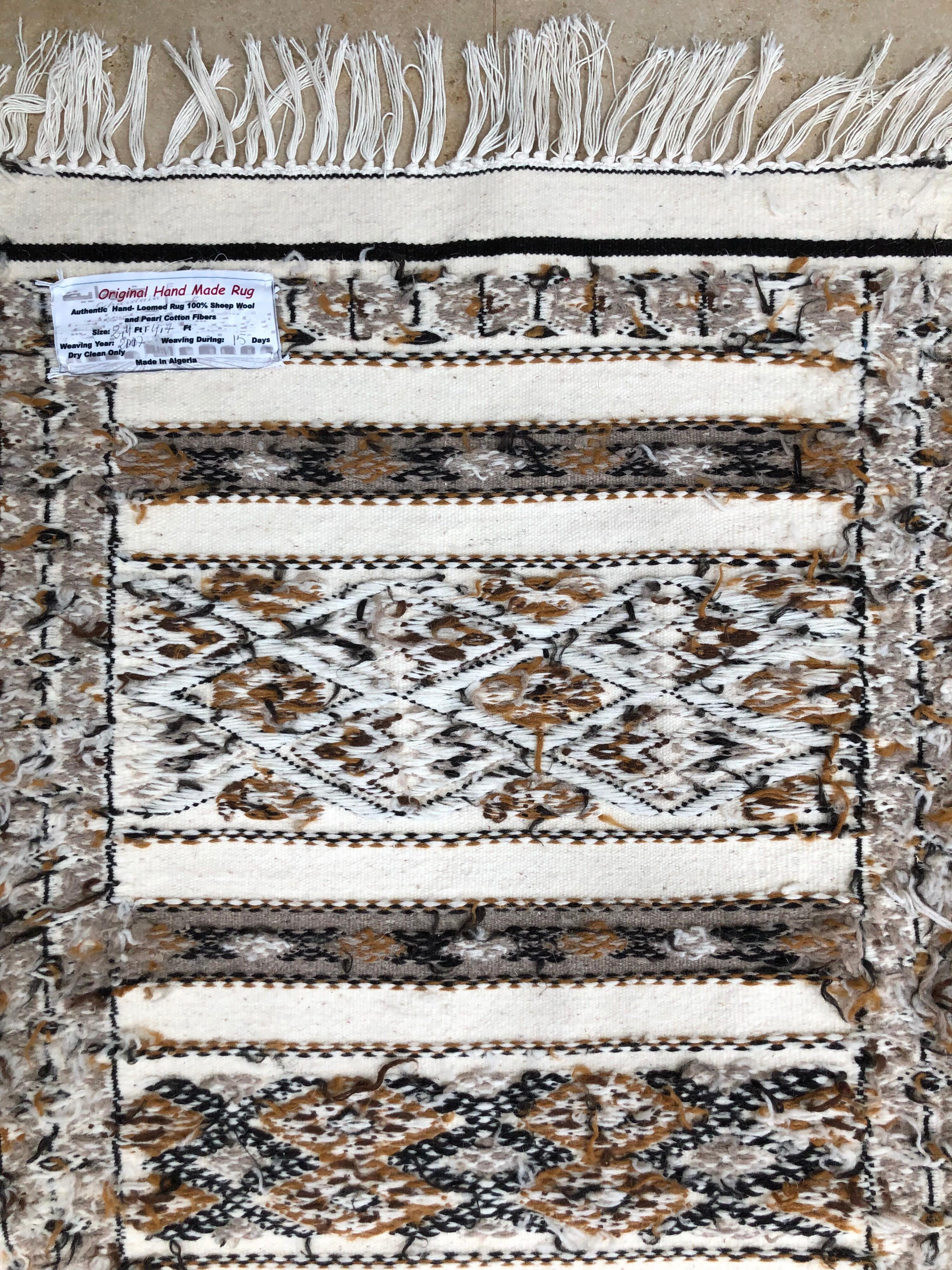 Contemporary Hand-Loomed Berber Tribal Natural Wool Throw Rug, Neutral Beige For Sale