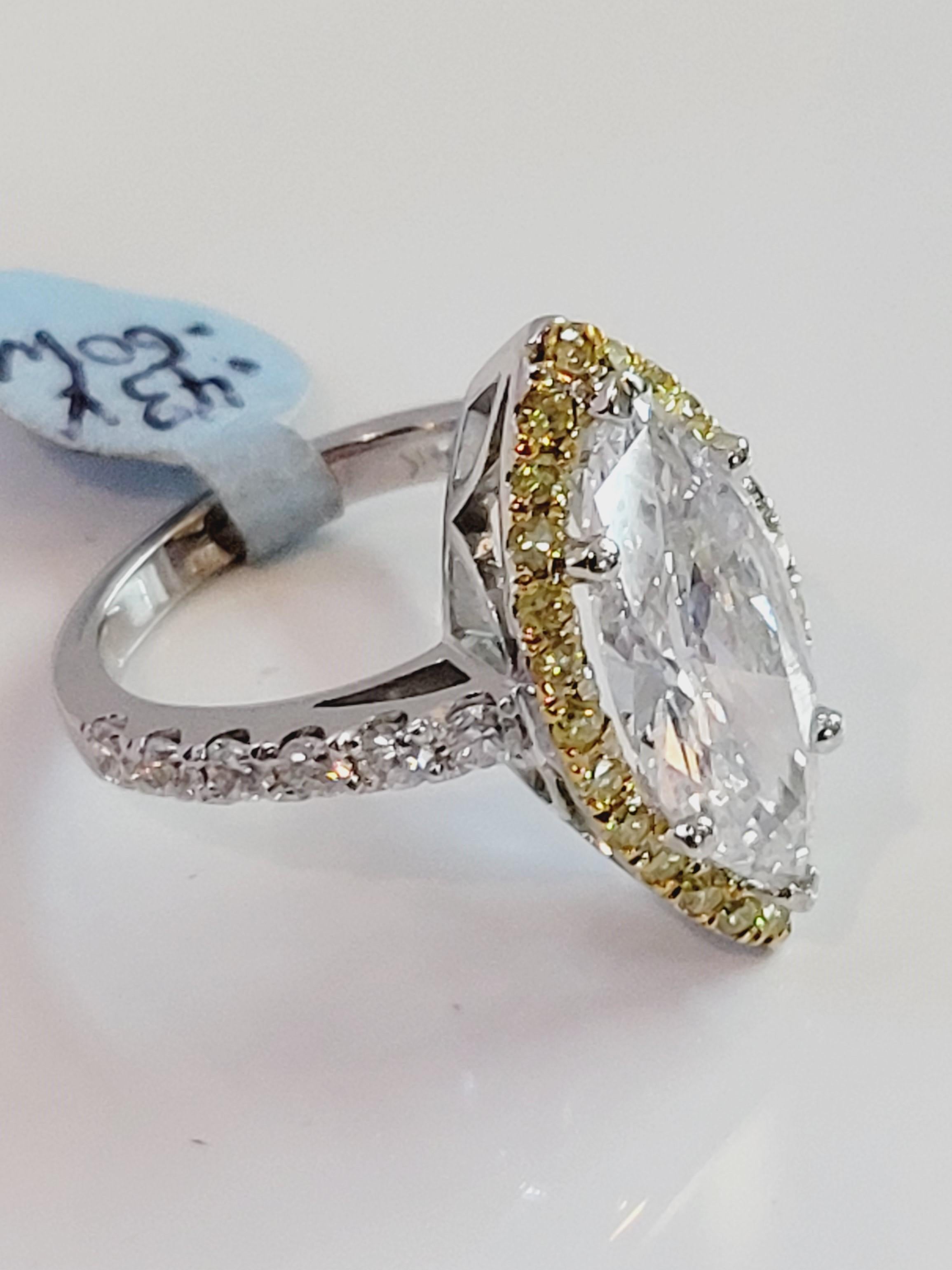Hand Made 
14K White Gold 
Gender Women
Condition New 
Center Diamond 3.04ct 
Clarity SI
Color Grade I
White Dia .60ct 
Clarity VS
Color Grade G
Yellow Natural Dia .40ct
This Ring is Resizable 
Retail Price:$85000