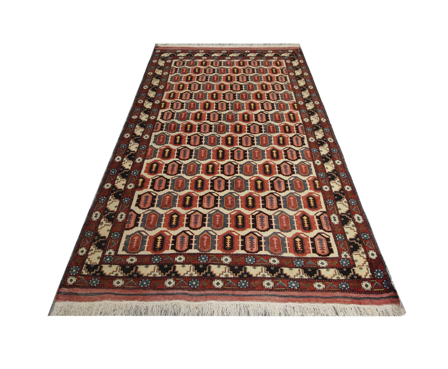 This all-over repeat pattern, antique Caucasian rug was handwoven in 1940 with hand-spun, vegetable-dyed wool, and cotton, by some of the finest tribal artisans. Featuring sharp colours layered in motifs amongst a repeat pattern that fills the