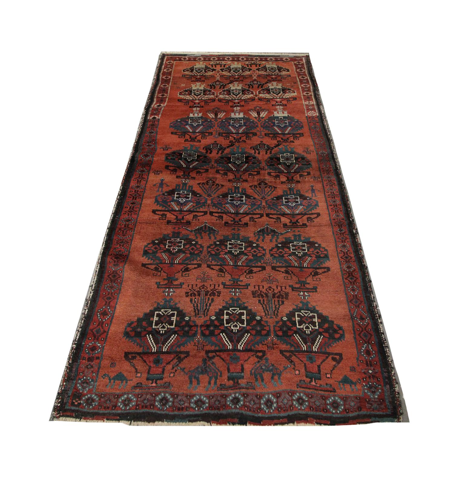 This high-quality antique Azerbaijan living room rug features a repeat pattern of vase-like motifs and camel emblems intricately handwoven in 1930 with handspun cotton and wool, dyed using organic vegetable dyes. This is enclosed with a repeat