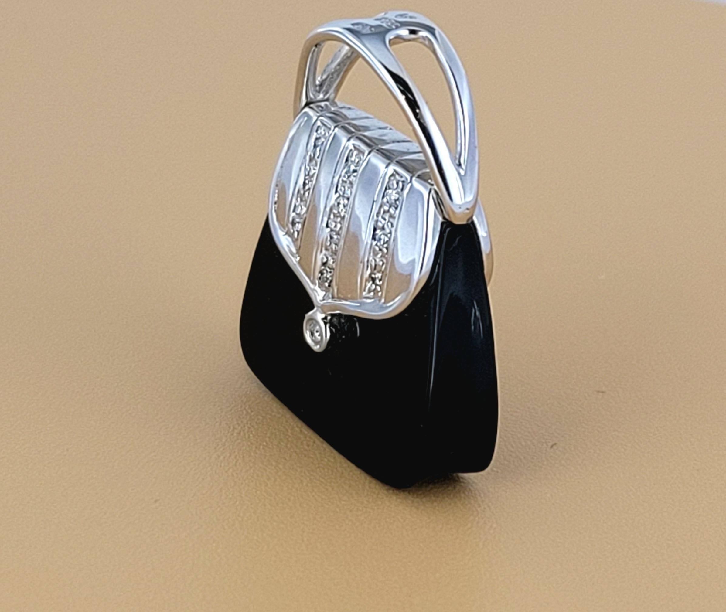 Hand Made Bag Pendant with Diamonds 
Material: 14K White Gold
Diamonds: .18ct
Diamond Clarity: SI
Color Grade: G
Pendant Dimension: 22.5mm X 18mm
Condition: New, never worn
Retail Price: $650