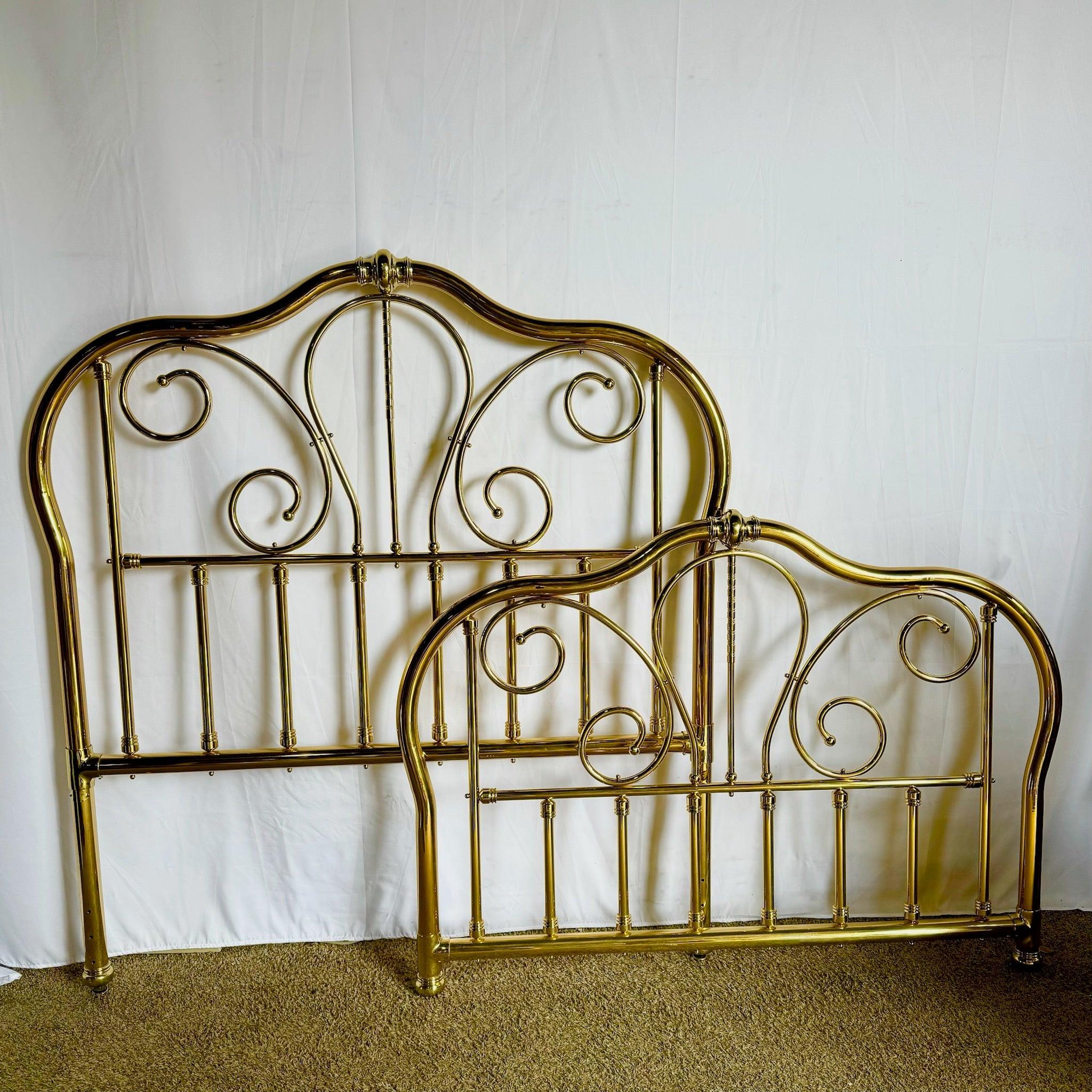 Handmade brass queen headboard and footboard by Joao Isabel, featuring graceful scrolling details and a lustrous golden finish, perfect for elegant interiors.
 
 Minor pitting as shown in the photos. One brass screw cap is missing as shown in the
