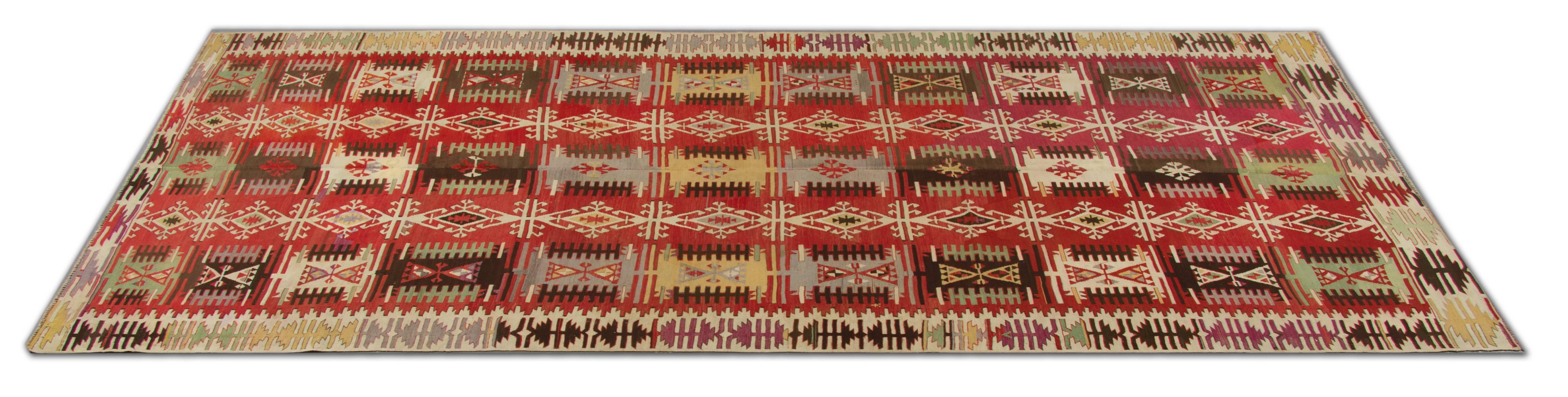 These are handmade carpet antique rugs from Konya, which is located in the heart of Turkey. These large rugs are in excellent condition. The workshop Kilims of Konya are mostly known for their distinctive geometric rug designs. This tribal rug has
