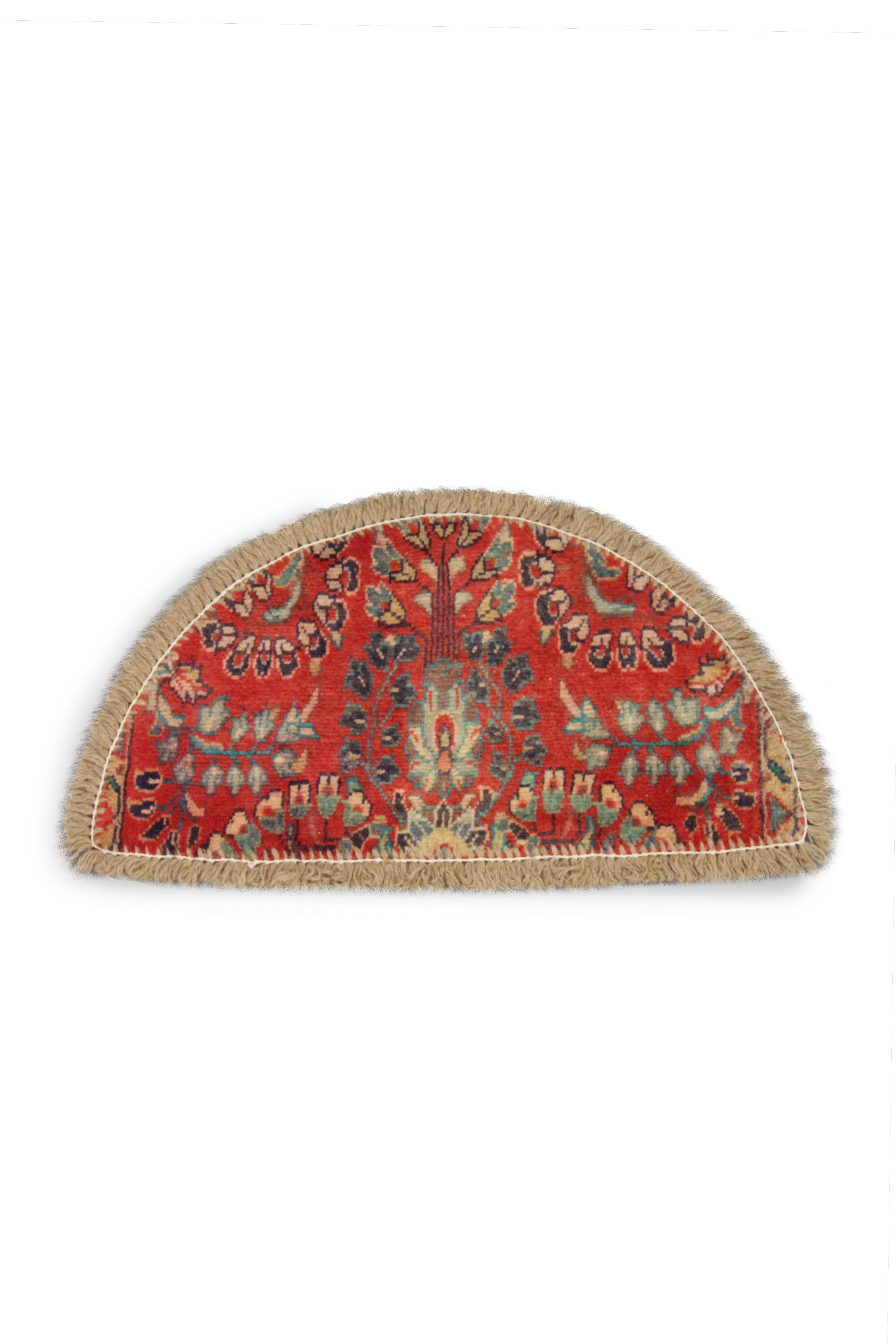 Handmade carpet stunning orange/red drenches the background on this little Oriental rug, contrasting with the intricate floral details which have been woven in deep blue and green symmetrical patterns. This semicircle entranceway doormat has been