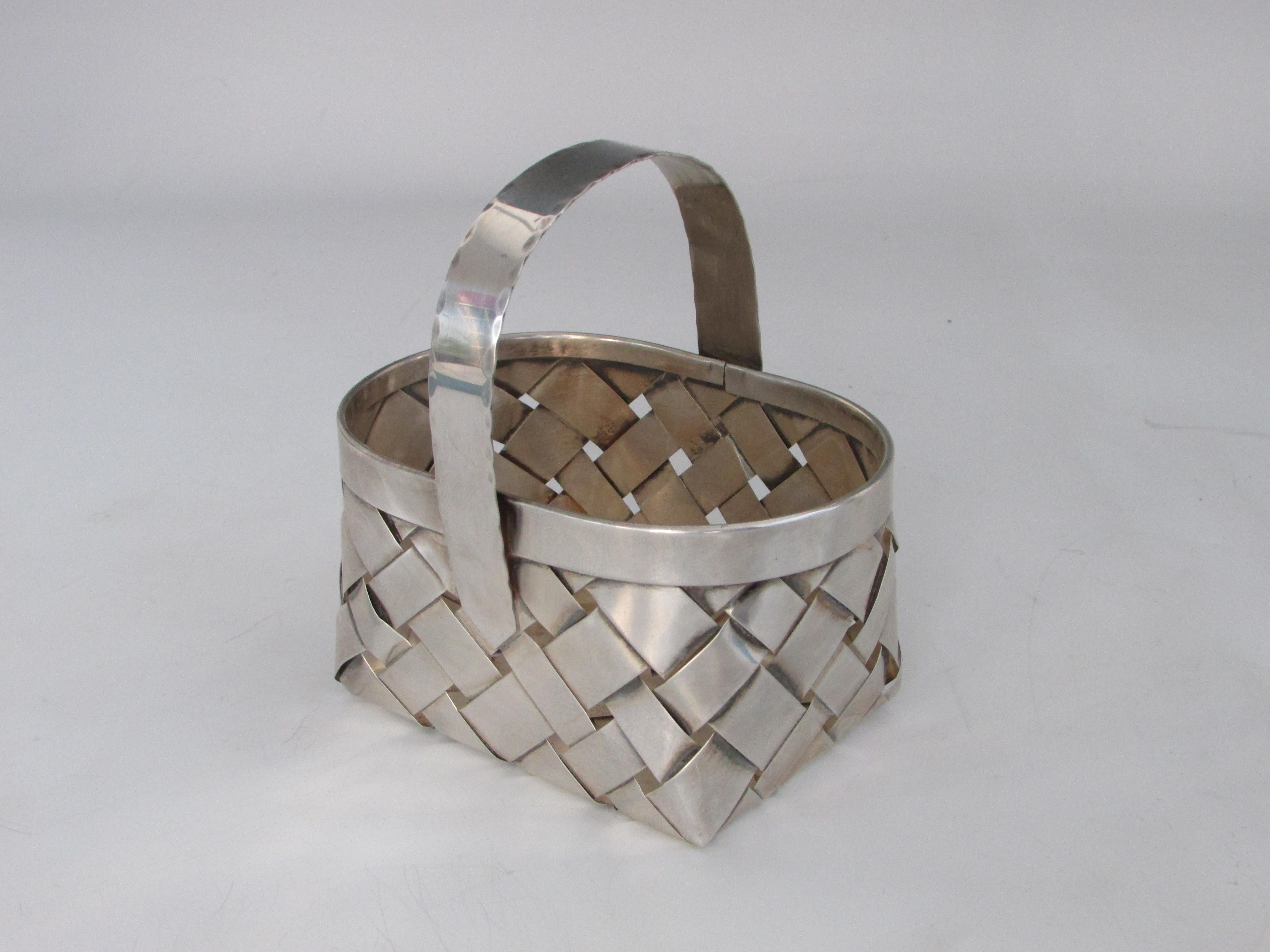 Basket made of woven sterling silver. Marked Cartier hand made sterling.