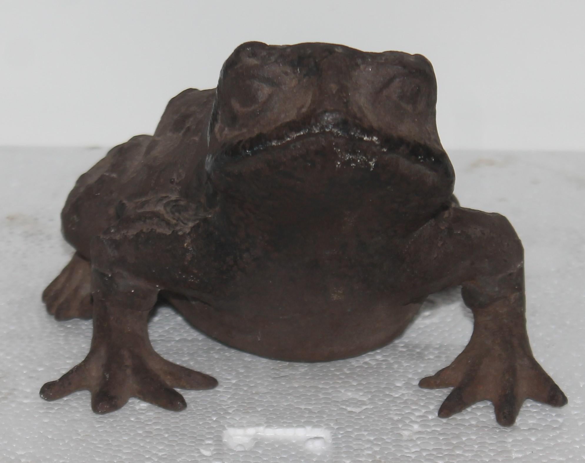 This amazing hand cast iron frog has great weight and great Folk Art too. The condition is very good.