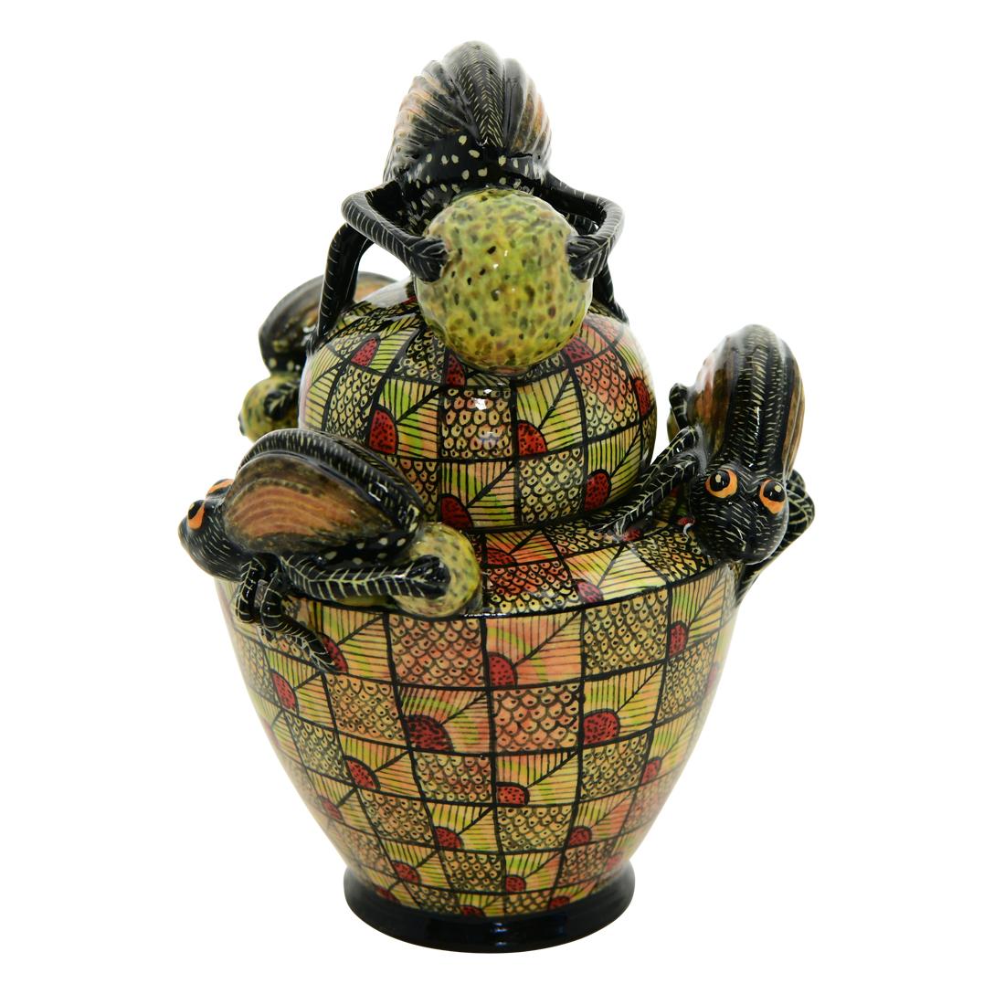 This Beetle Box was hand sculpted by the renowned artisan Sbusiso Ndaba and beautifully painted by Sabelo Nene both from South Africa. This exquisite ceramic creation stands 5 inches high, measuring 3.5 inches in length and 3.5 inches in width. 
A