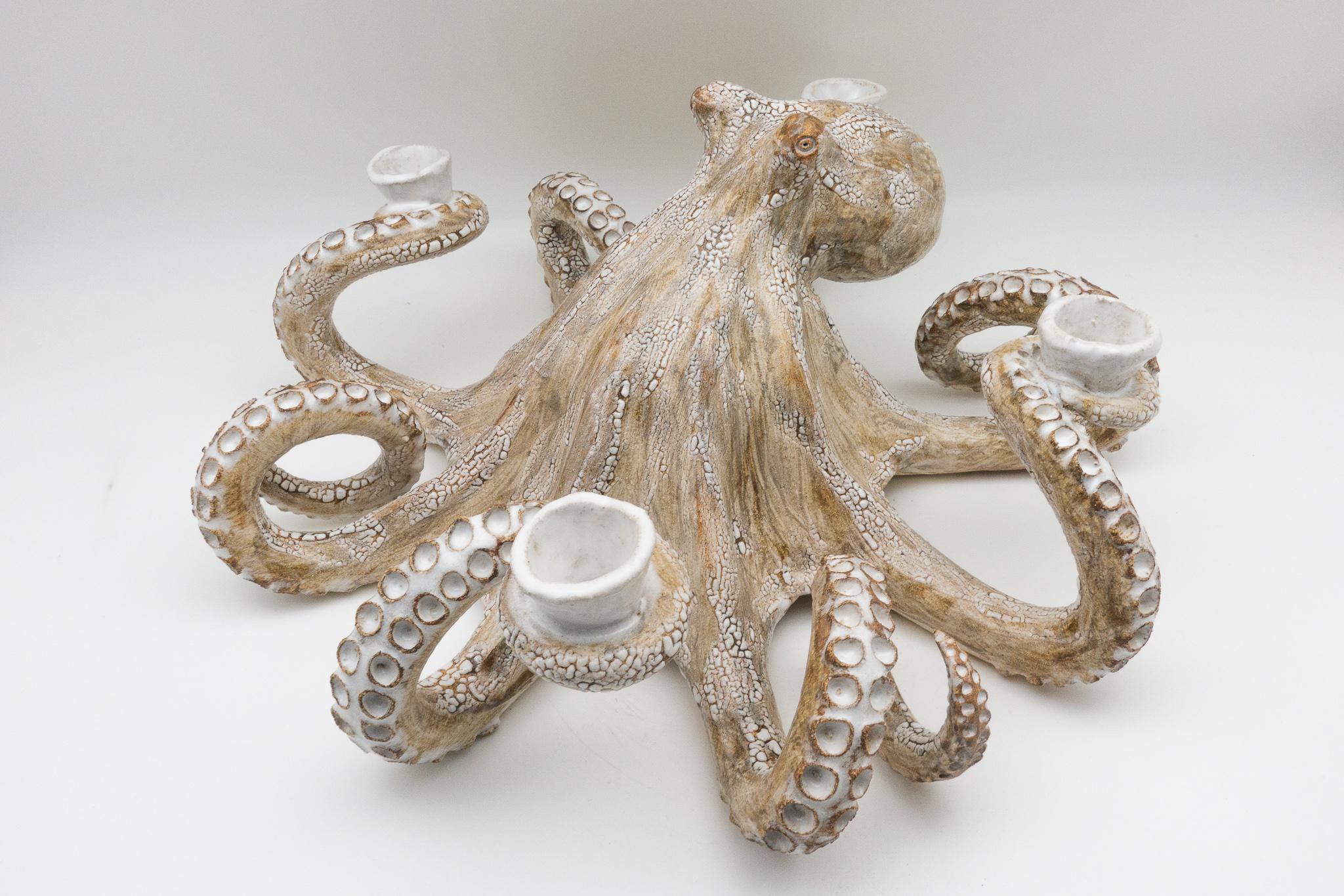 Octopus candelabra completely handmade from start to finish using stoneware clay. The entire sculpture is made freeform. Each individual tentacle is hand carved with specialized tools to form the suckers.