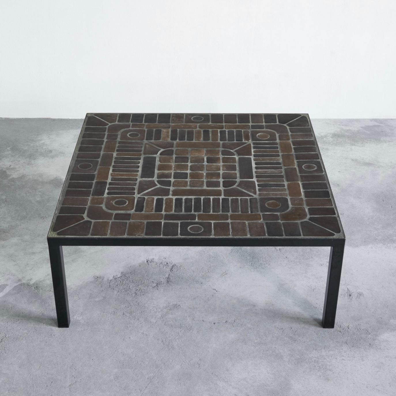 Coffee table in ceramic tiles and metal, Belgium, 1960s.

This is a truly wonderful mid-century coffee table in ceramic tiles and metal. An almost certain Belgian made table, since the original owners bought it in a high-end Belgian furniture store