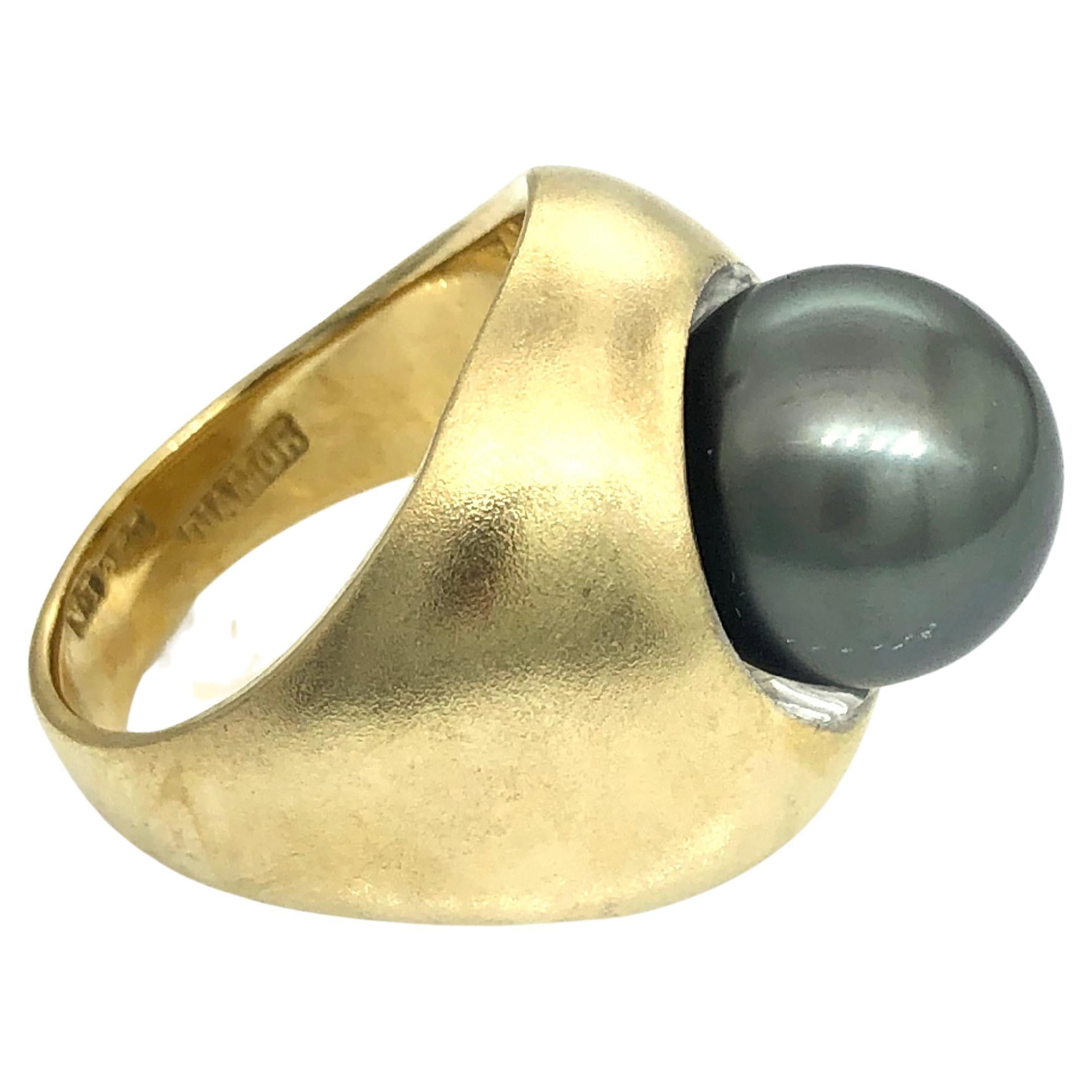 Fully hand made
solid 18 carat yellow gold ring in matte finish
set with recessed one stunning round Tahitian Black Pearl
Diameter of pearl is 12 mm
Size of the ring is N 1/2 (US Size 7)
Weight of the ring is 16.8 grams
This ring could be resized to