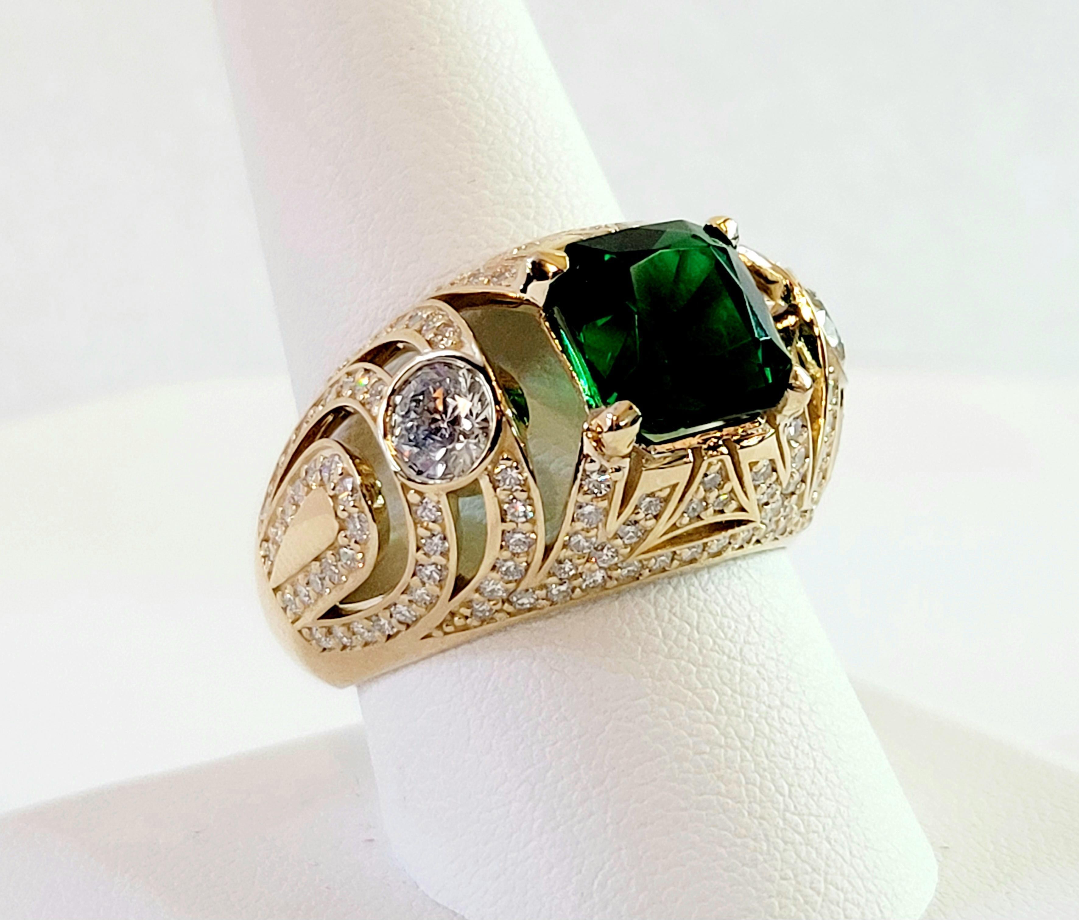 Hand Made Ring with Diamonds 
Ring Size 10.25 
Material 14K Yellow Gold
Center stone Emerald
Emerald: CZ , dimension 9 x 9mm 
2 stone: .35ct each, 70ct total
Diamonds:2.5ct
Total Carat: 3.20ct
Diamond Clarity VS
Color Grade G
Weight: 12.4gr 