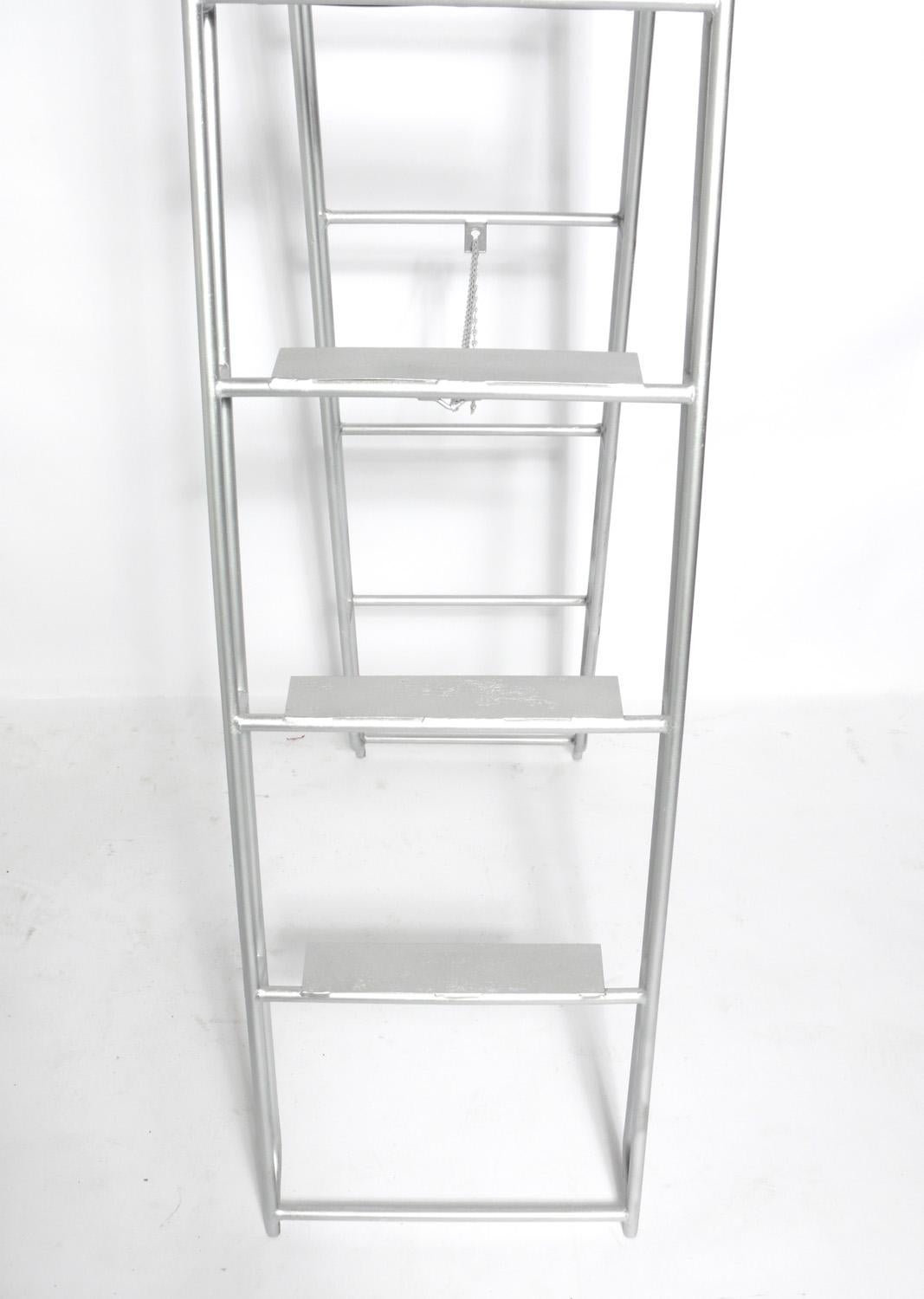 Hand made Industrial ladder, American, circa 1940s. Perfect in a home as a library or loft ladder, or in a commercial setting to display hanging items, such as clothing or blankets.