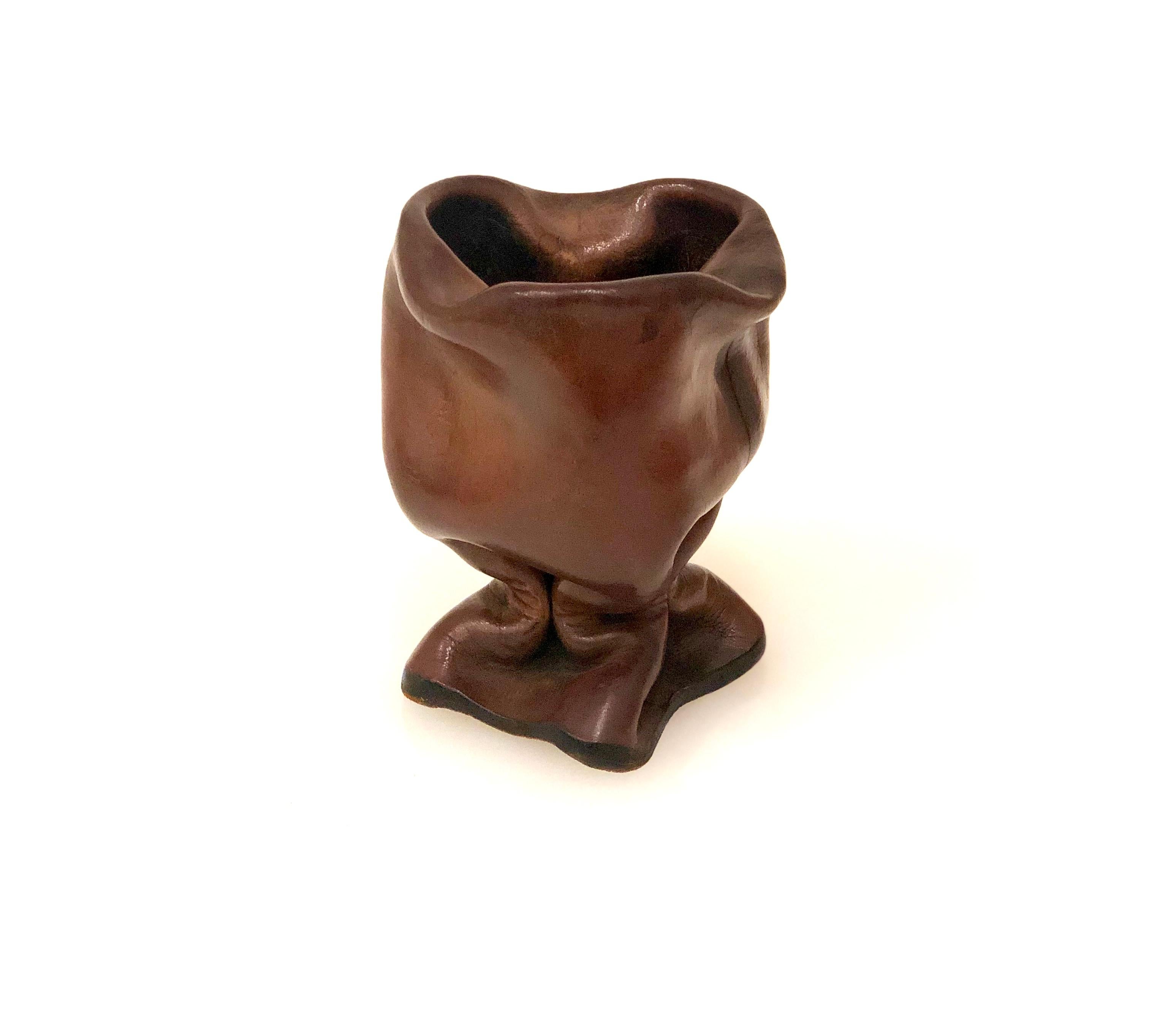 A rare drinking vessel or cup made from thick molded leather, Italian, 20th century.
 