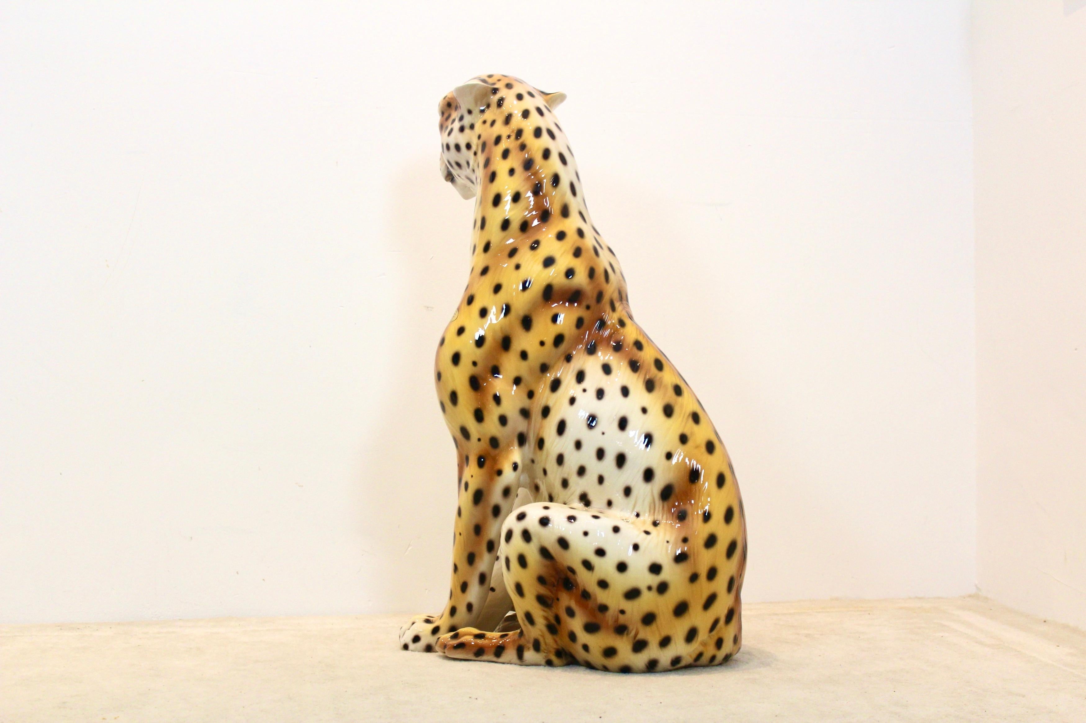 A Stunning and beautiful hand painted ceramic Leopard sculpture made in Italy. This Leopard is in Excellent condition and marked. This is quite a large (life-size) Leopard which makes it a very nice decoration object. Comes with very nice details a