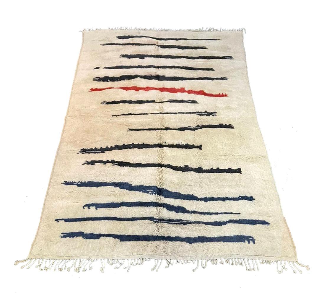 Authentic Moroccan rug showcasing beautiful abstract design. Exclusively designed by Gordian Rugs. Made from 100% wool. Size shown is 8 x 10.