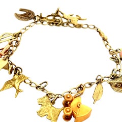 Hand Made Movable 14 Charm Armband 10K YG Ca. 1950