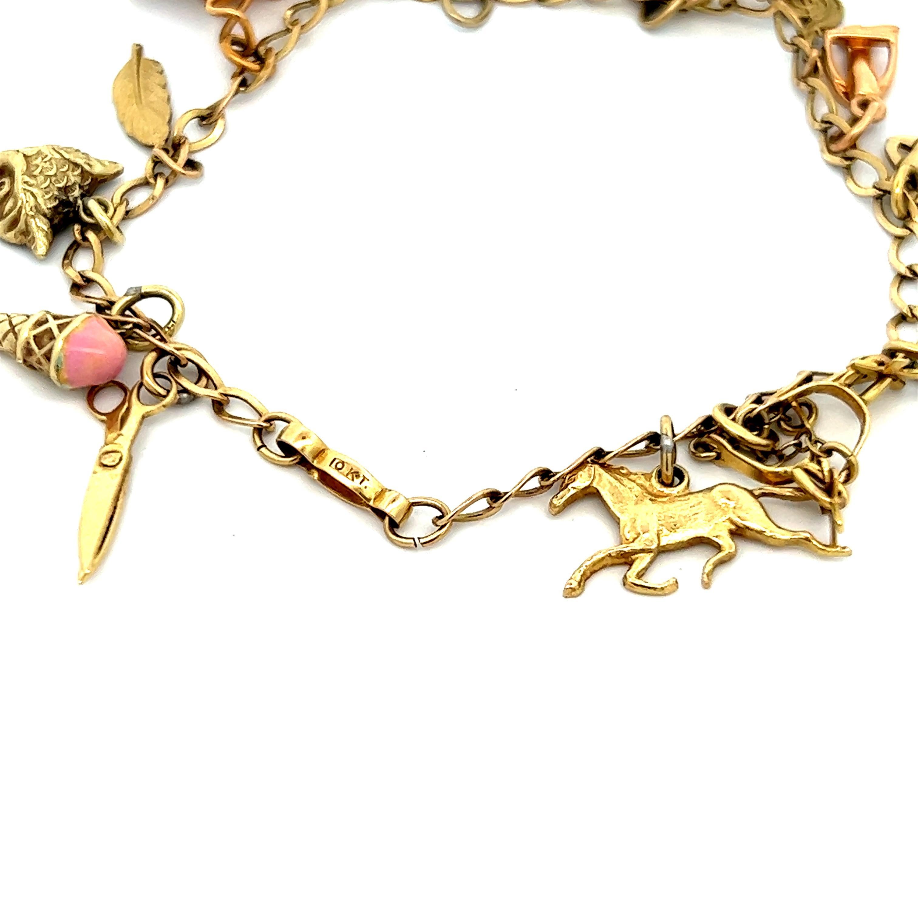 Donna Hand Made Bracciale mobile 14 charme 10K YG Ca. 1950 in vendita