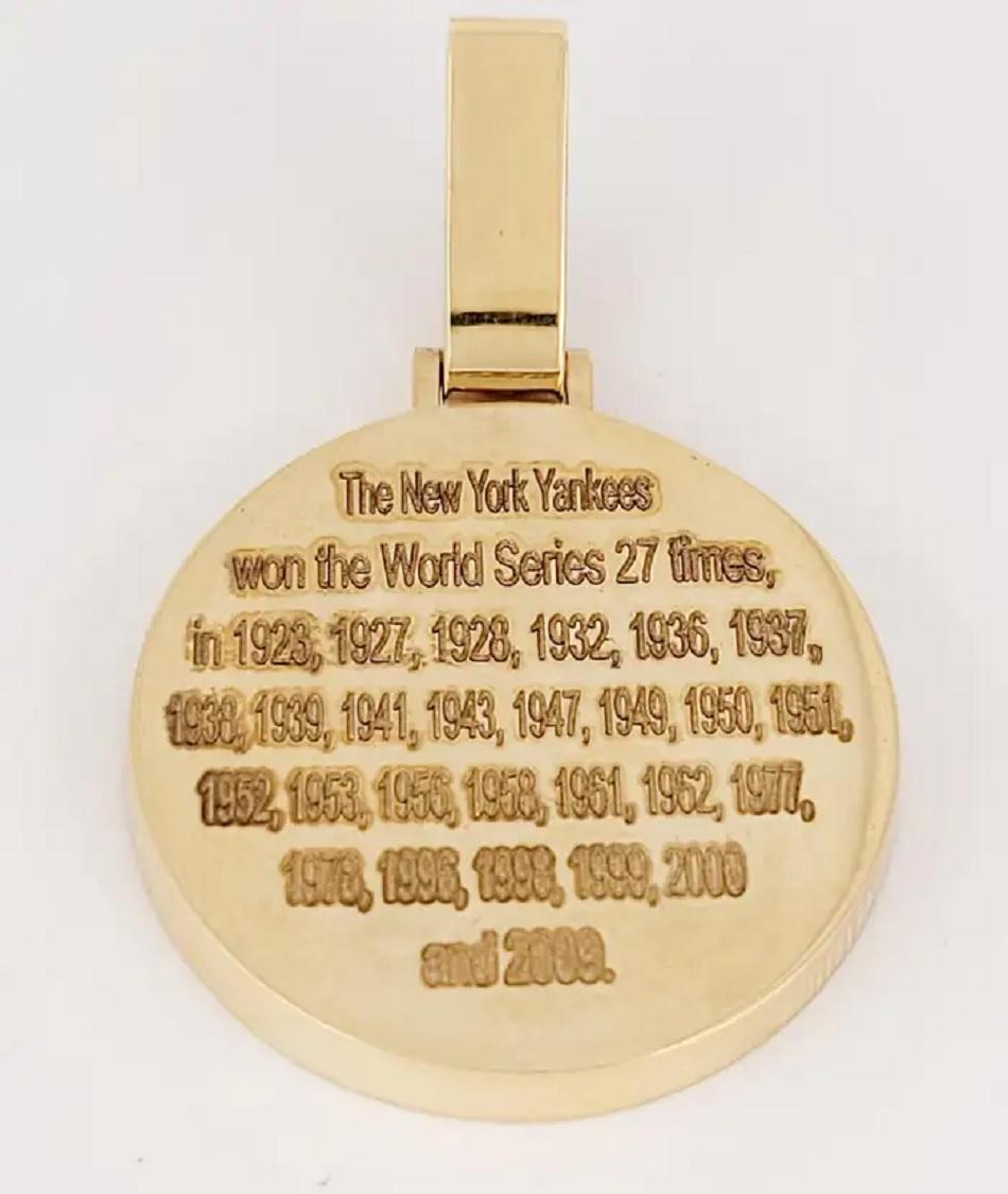 Hand-Made NY Pendant
Material 14K yellow Gold
Sapphire .90ct
Diamonds 2.00ct
Diamond Clarity VS
Color Grade G
Weight 19 gr

Pendant Dimensions:
Pendant Wide 29.3 mm
Pendant Width 3.6mm
Pendant Length 33.2 mm
Length With Bail 46mm

Bail