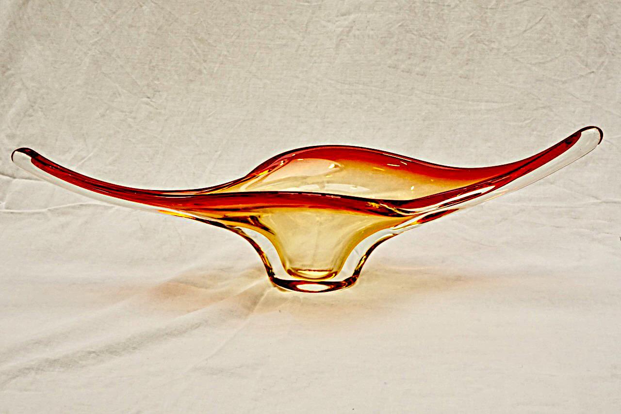 Heavy hand made art glass bowl in a beautiful red, orange, yellow and clear colourway. The bowl has a lovely curved organic shape. It is in very good condition, with some scratching. Measuring length 57.5 cm / 22.6 inches, depth 14.8 cm / 5.8