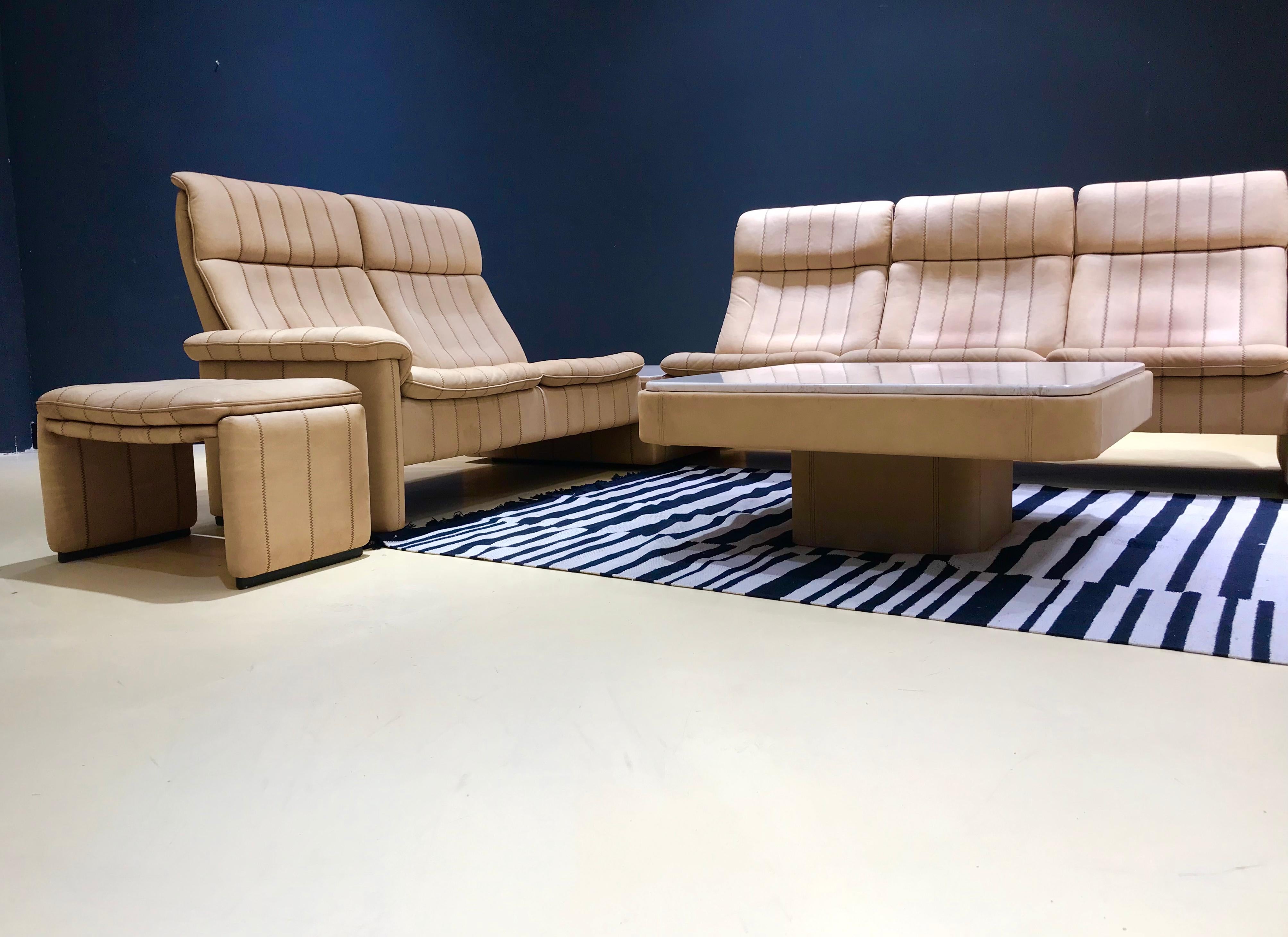 This large vintage livingroom set was manufactured by De Sede by order of a well-to-do German doctor from Germany in the 1970s. The living room set is tailor-made and entirely handmade by De Sede in Switzerland. The set consists of a 2 and a 3-seat.