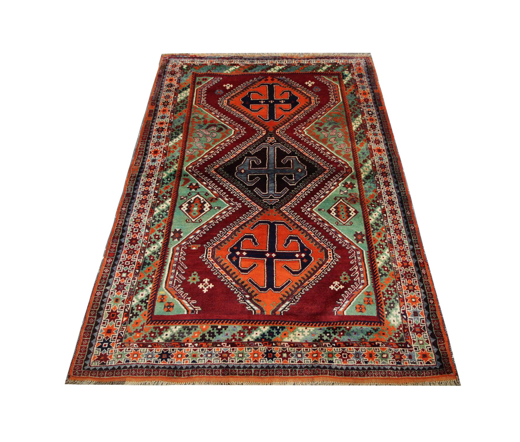 Vibrant colours drench this high-quality vintage Tribal rug was handwoven in 1950 with hand-spun, vegetable-dyed wool, and cotton, by some of the finest Caucasian artisans. Perfect for both modern or traditional interiors, bedrooms, living rooms or