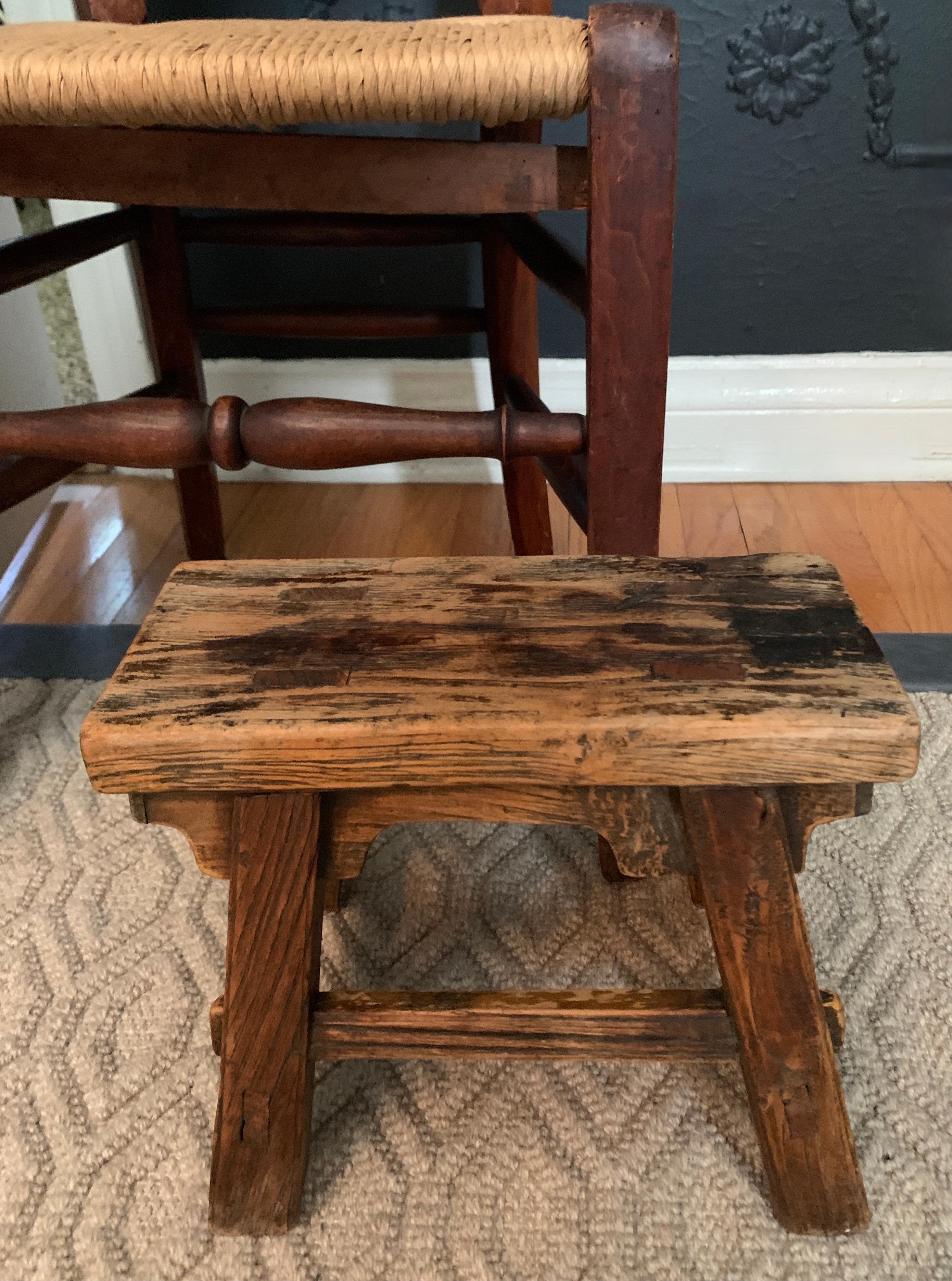 An exceptional milk or step stool hand crafted of solid wood with no modern screws, or nails. The stool is entirely jointed tongue and groove, and carved with precision and care, finish nails are used to apply the end caps which are not weight