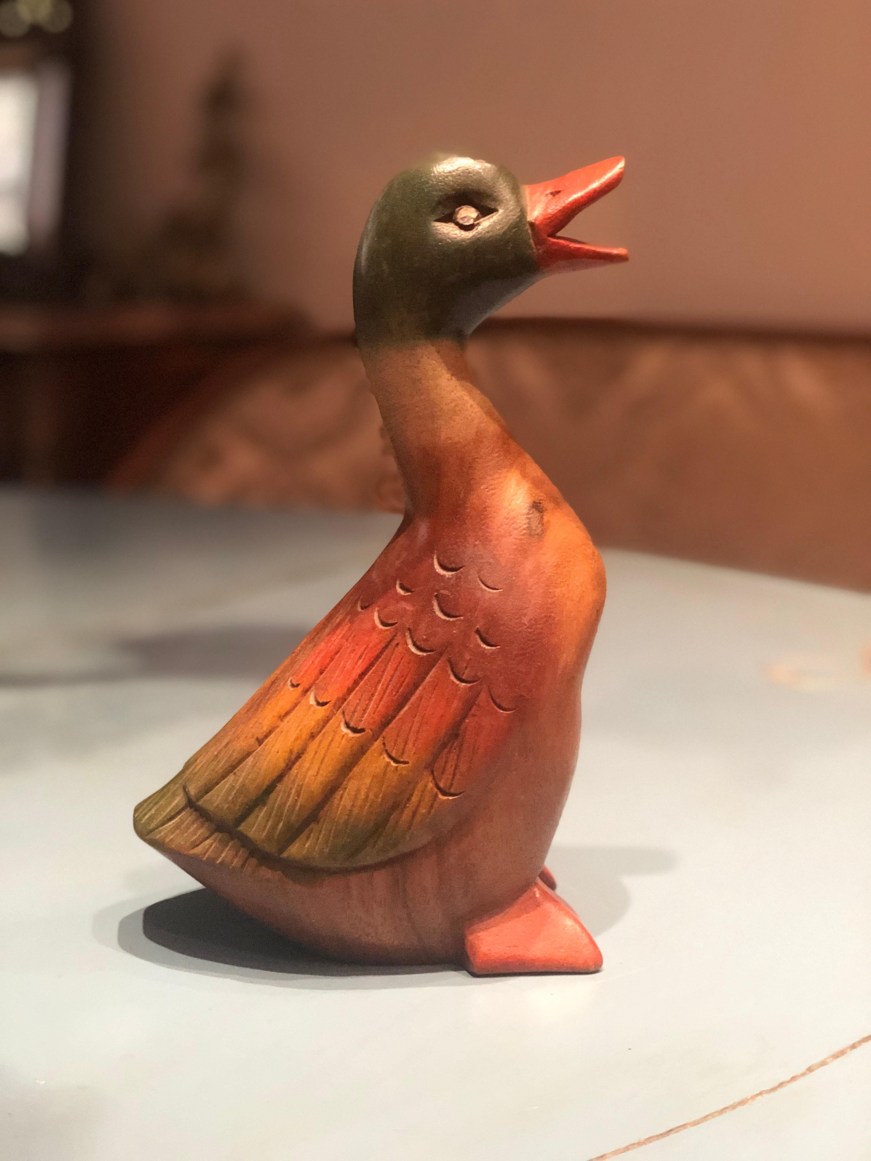 Handmade wooden duck painted in natural colors.
France, 20th century.
