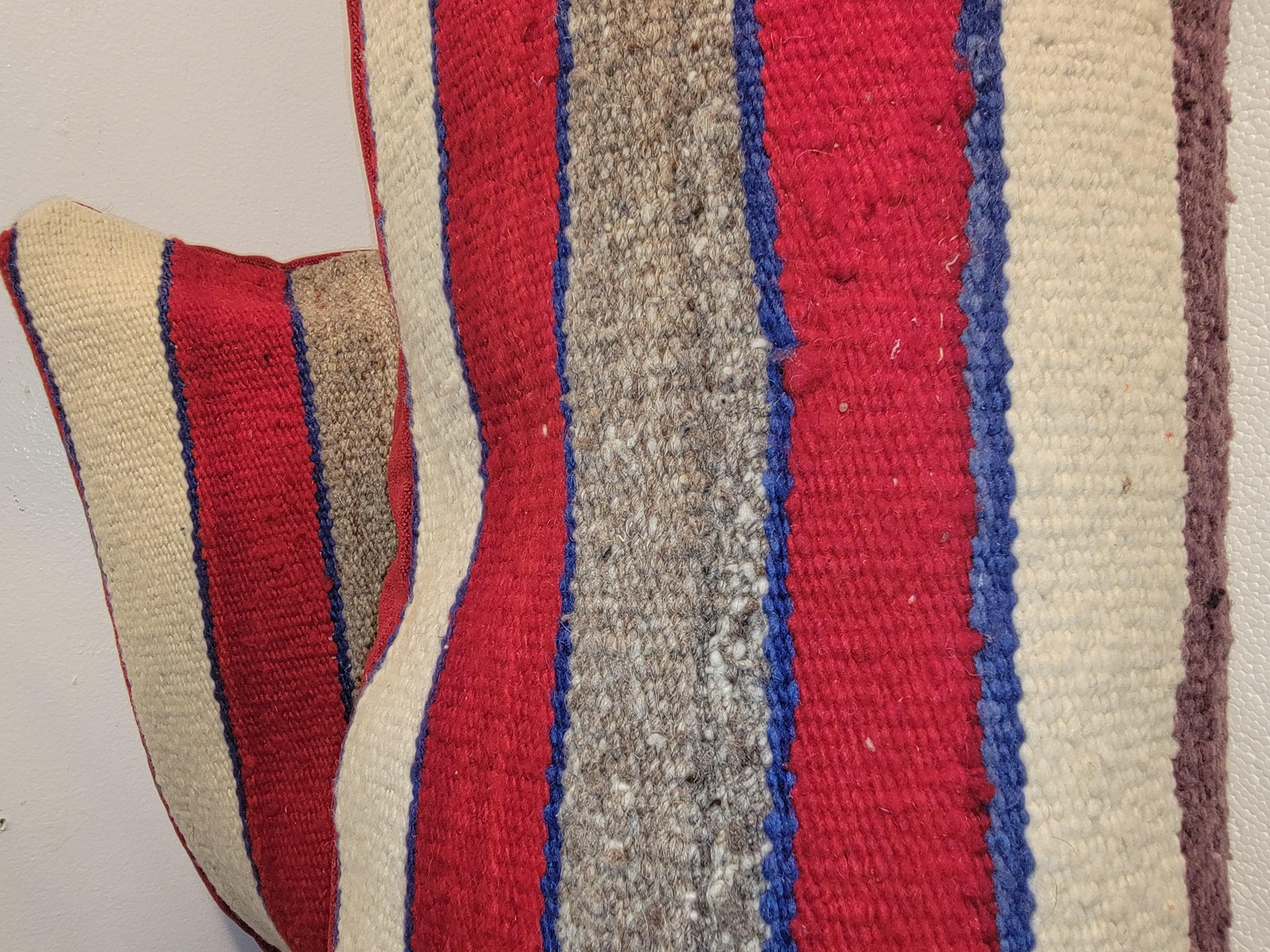 hand made wool; striped weaving pillows. Tightly woven with beautiful color pallet. Backing is mad from a beautiful red silk velvet.