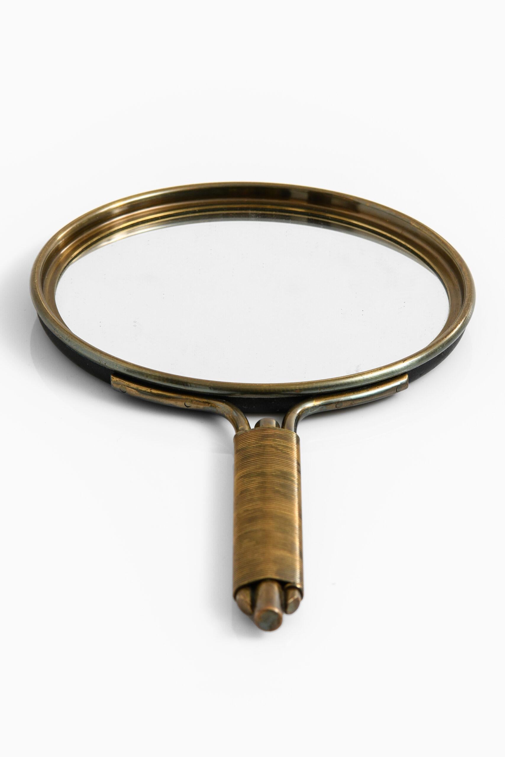 Rare hand mirror attributed to Hans-Agne Jakobsson. Probably produced by Hans-Agne Jakobsson AB in Markaryd, Sweden.