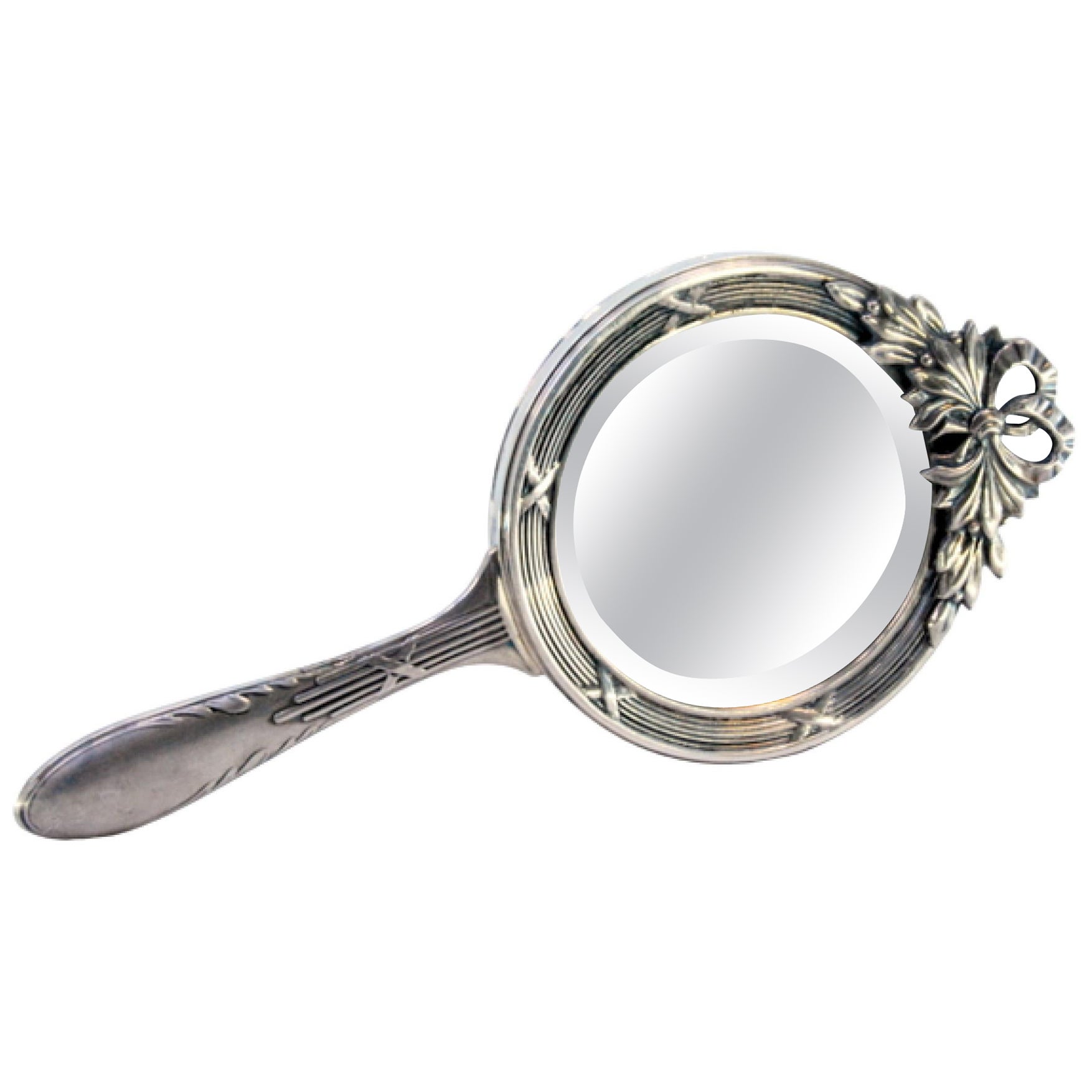 Hand mirror in embossed silver with bow and friezes around the edge