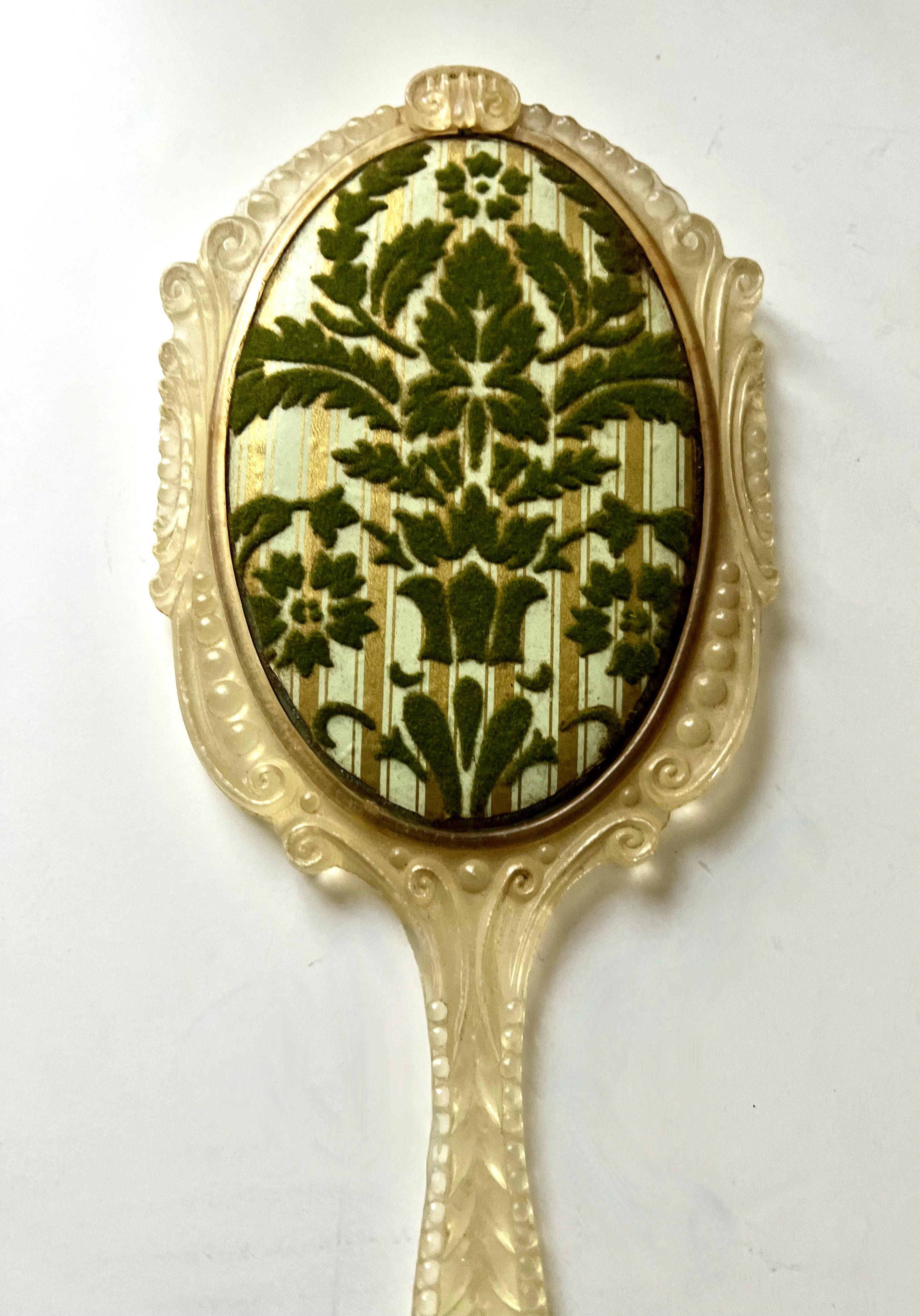 European Hand Mirror with Ornate Plastic Frame and Cut Velvet Decorative Backing For Sale