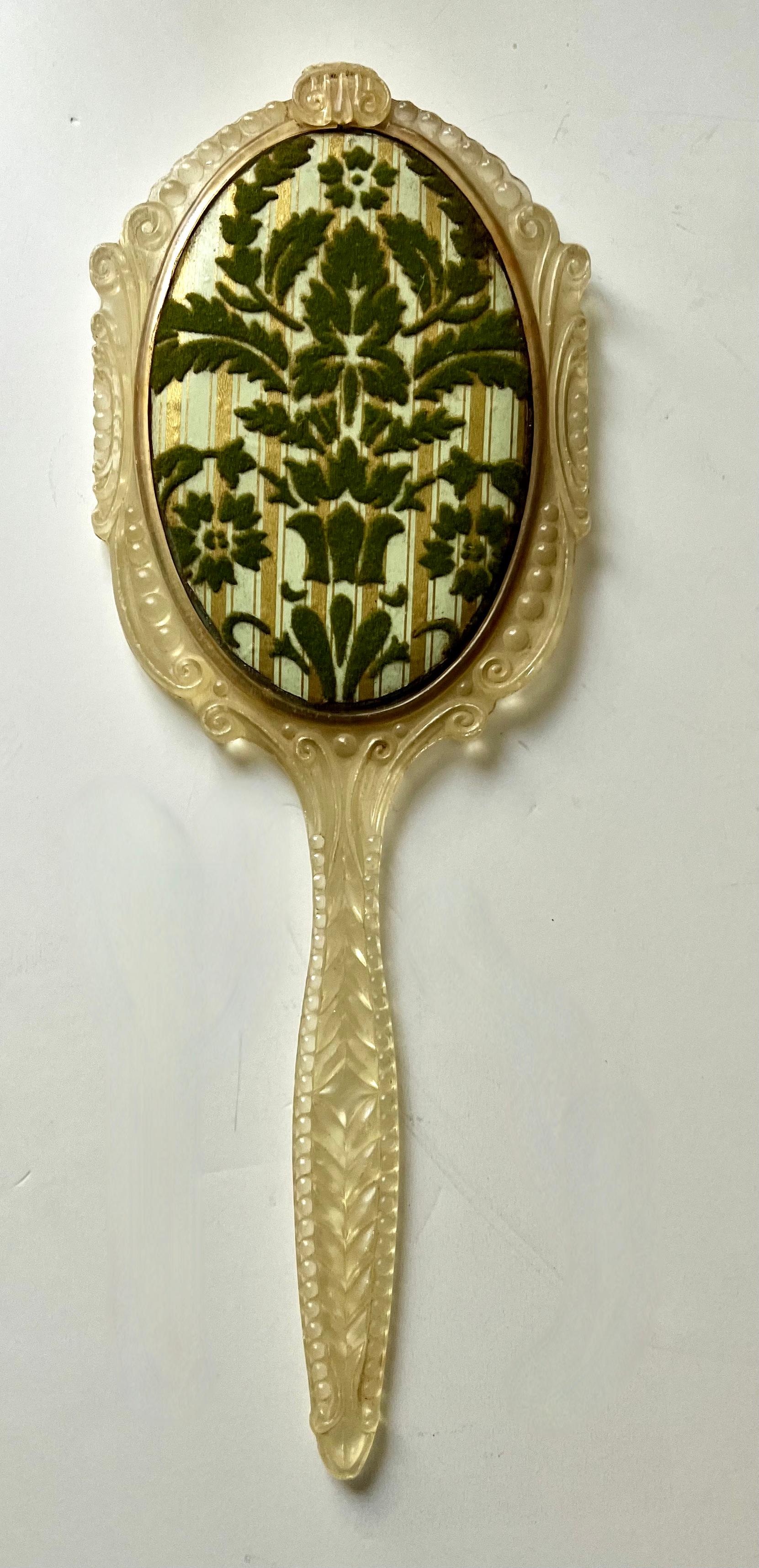 Patinated Hand Mirror with Ornate Plastic Frame and Cut Velvet Decorative Backing For Sale