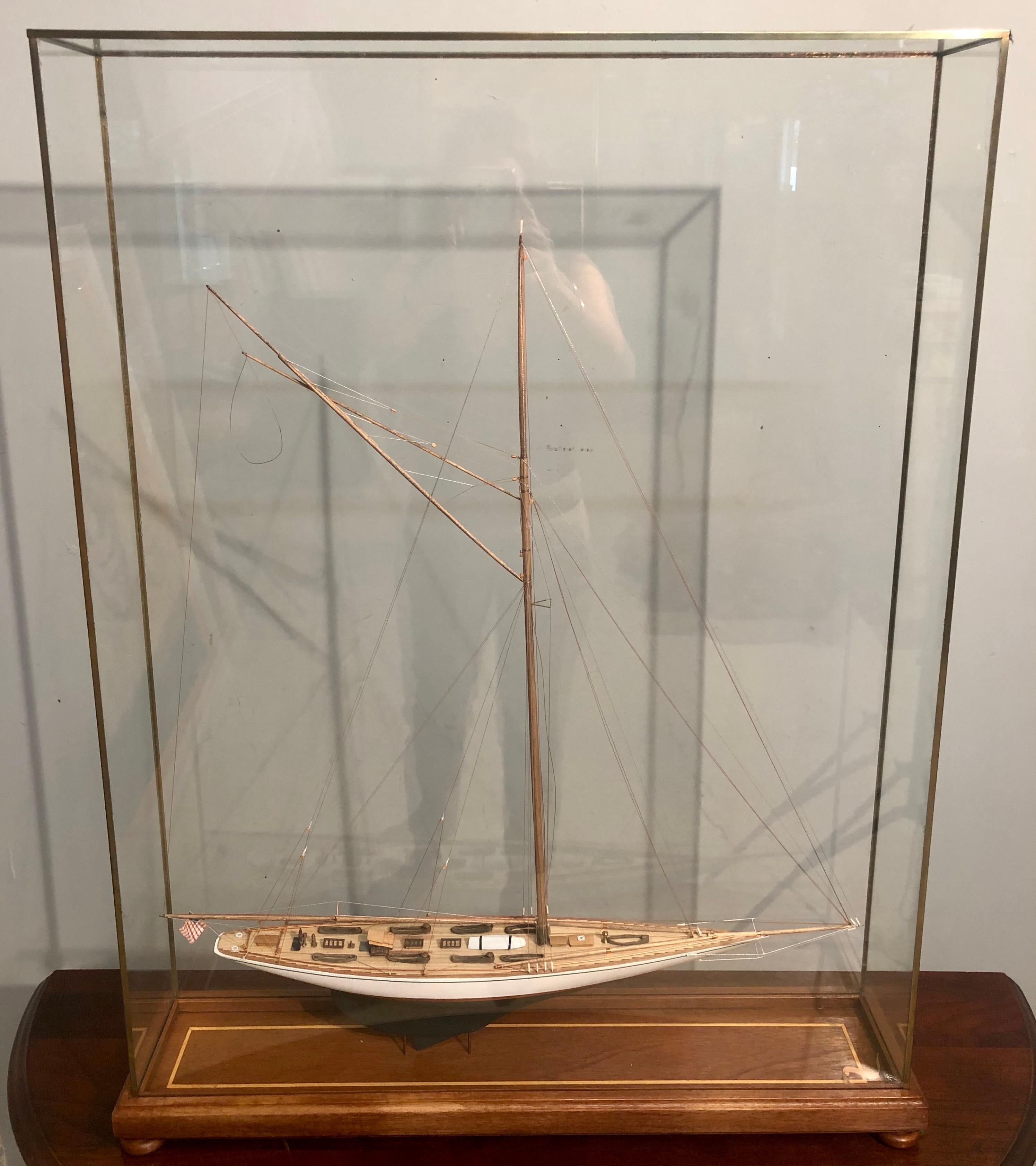 Hand modeled clipper ship in a glass and bronze case waving the American flag. A simply stunning clipper ship model leaving no detail to attention undone. A seemingly spectacular crafted ship as life like as possible in a custom all glass bronze