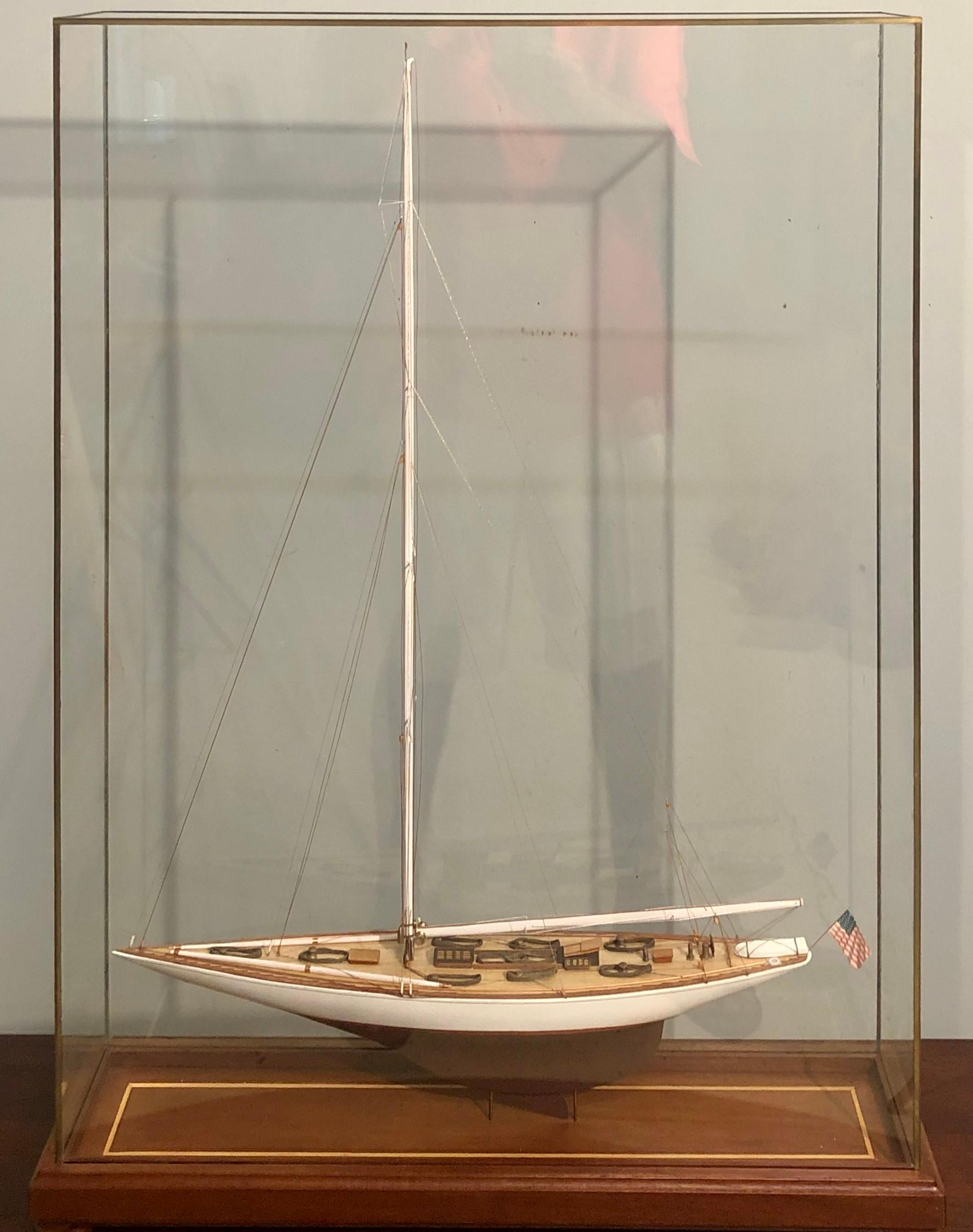 Hand modeled fore-and-aft rig in a glass and bronze case waving the American flag. A simply stunning clipper ship model leaving no detail to attention undone. A seemingly spectacular crafted ship as life like as possible in a custom all glass bronze