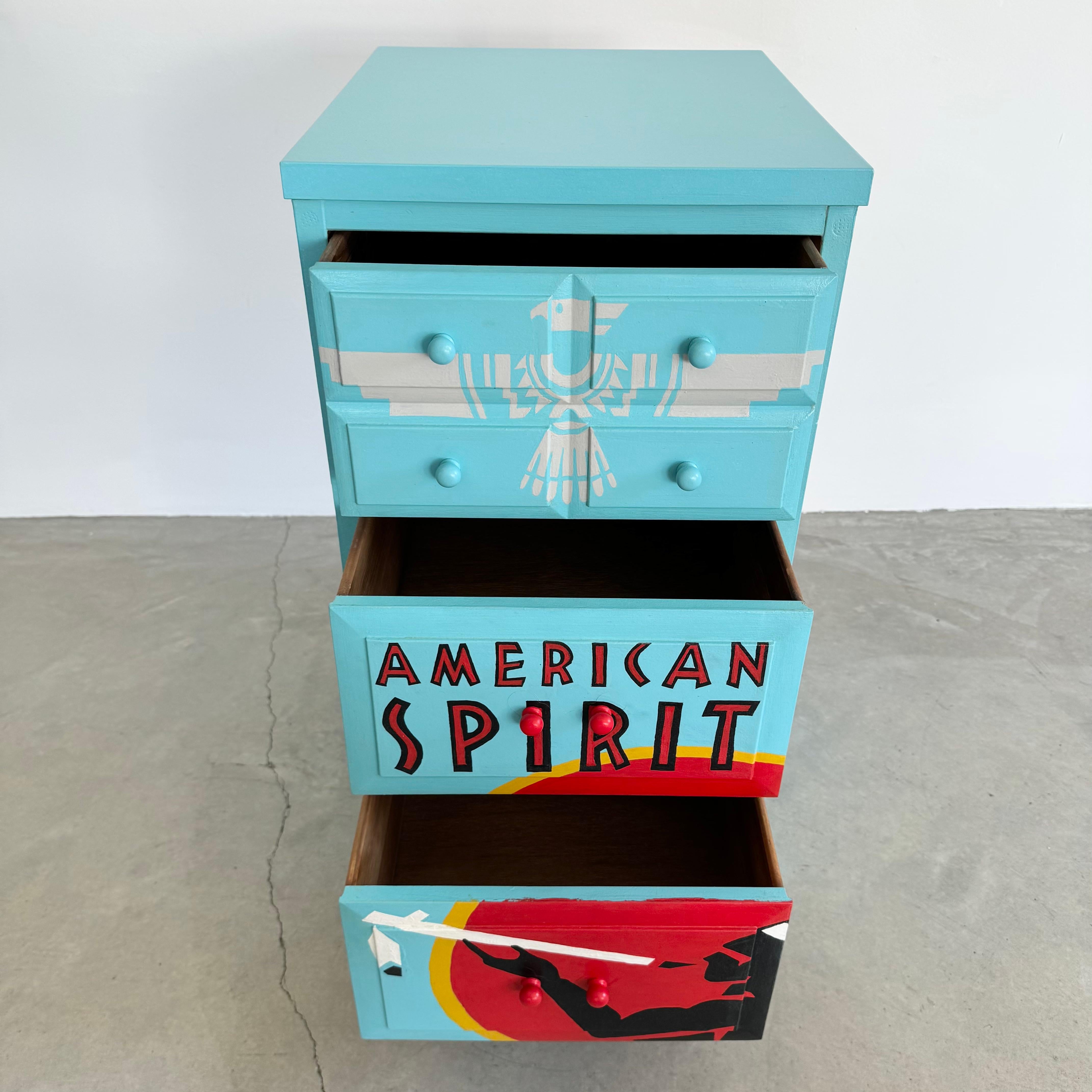 One of a kind dresser meticulously hand-painted to resemble a pack of American Sprit cigarettes. Vintage piece used by the artist, who spent more than 50 hours transforming the dresser into a functional piece of art. Features 3 pull out drawers with