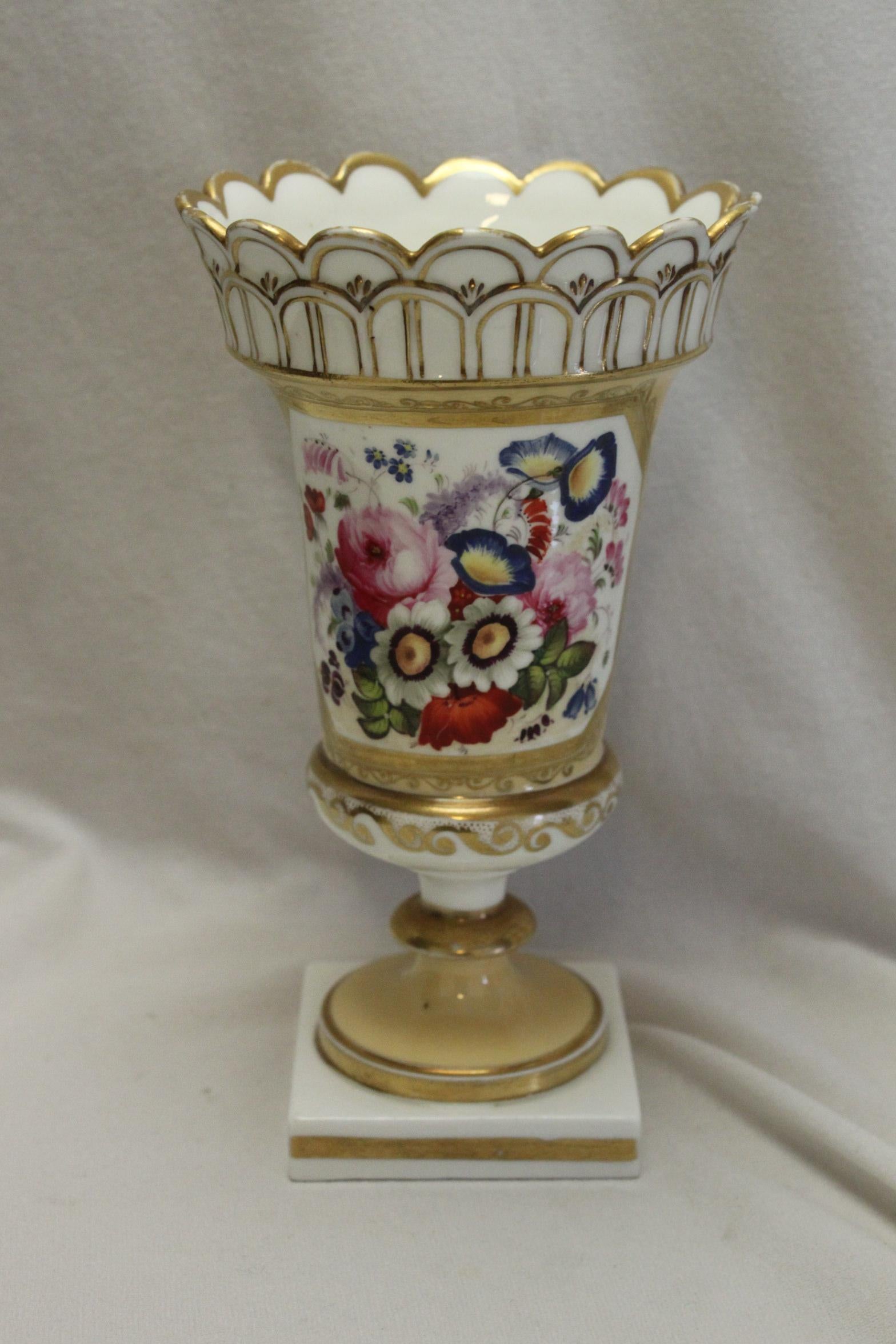 This very pretty hand painted and gilded porcelain vase is attributed to Minton, from their 