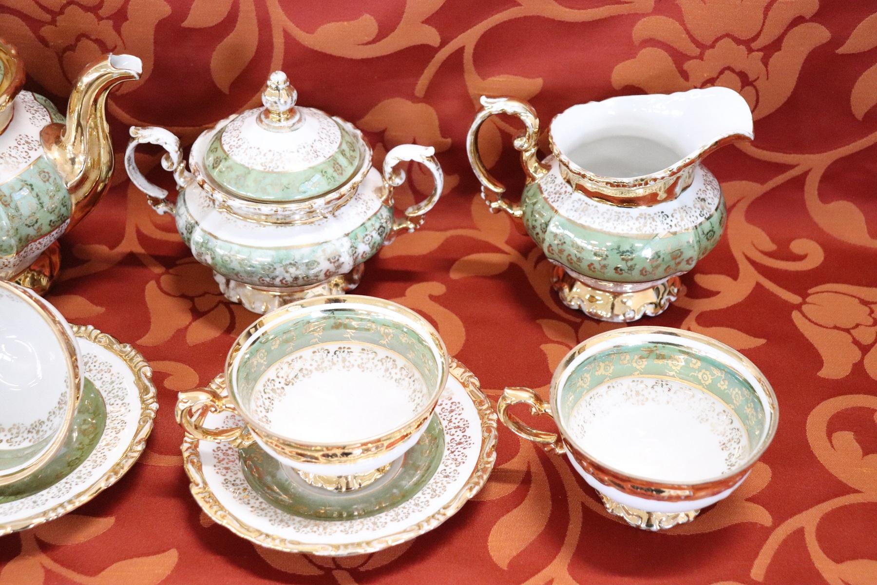 Beautiful hand painted and gold porcelain tea or coffee set by J Seltmann 15 pieces, 1920s. The service is complete to serve six people at the table includes: 1 teapot, 1 sugar bowl, 1 milk jug, six cups with saucers. The decoration is very refined