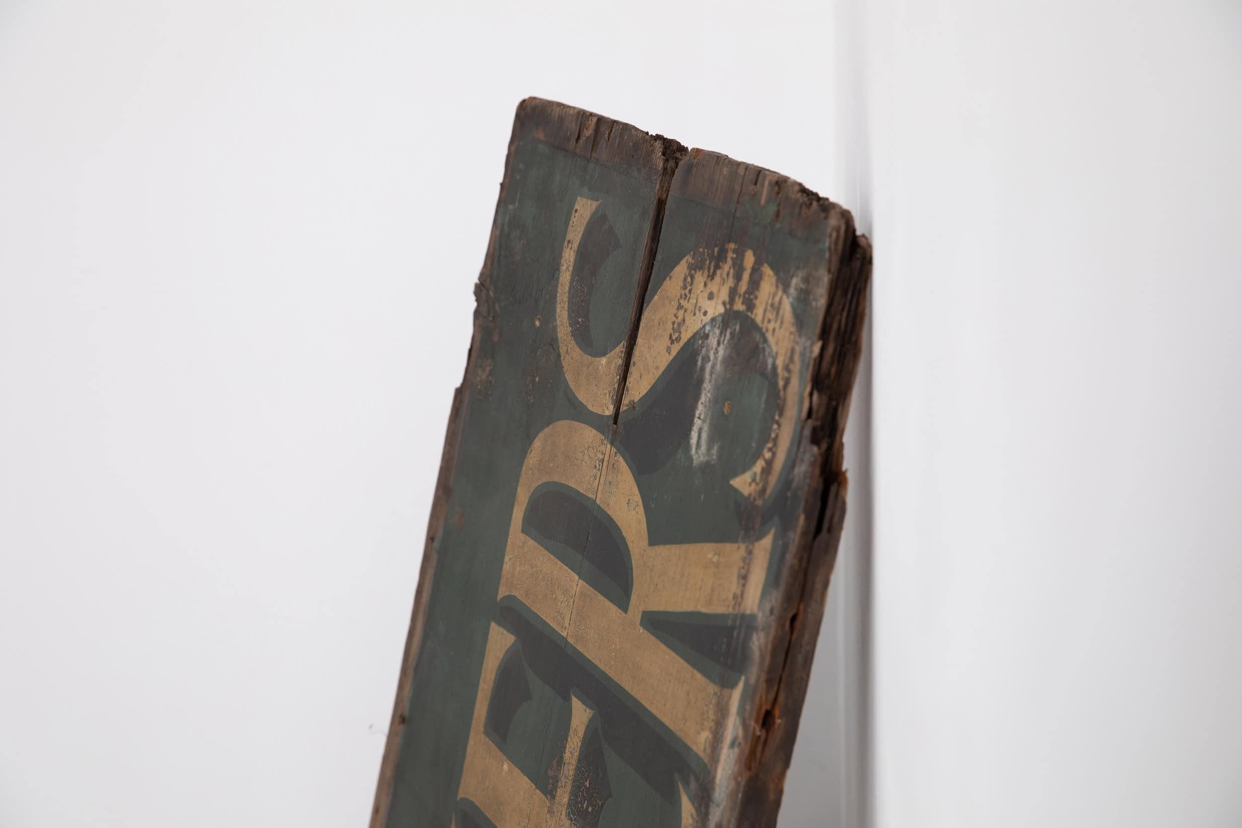

An attractive hand painted and double sided butcher's trade sign. c.1920.

Hand painted by a skilled sign-writer - gold lettering with shadows on a dark green background. Double sided, one sided having more wear than the other.
