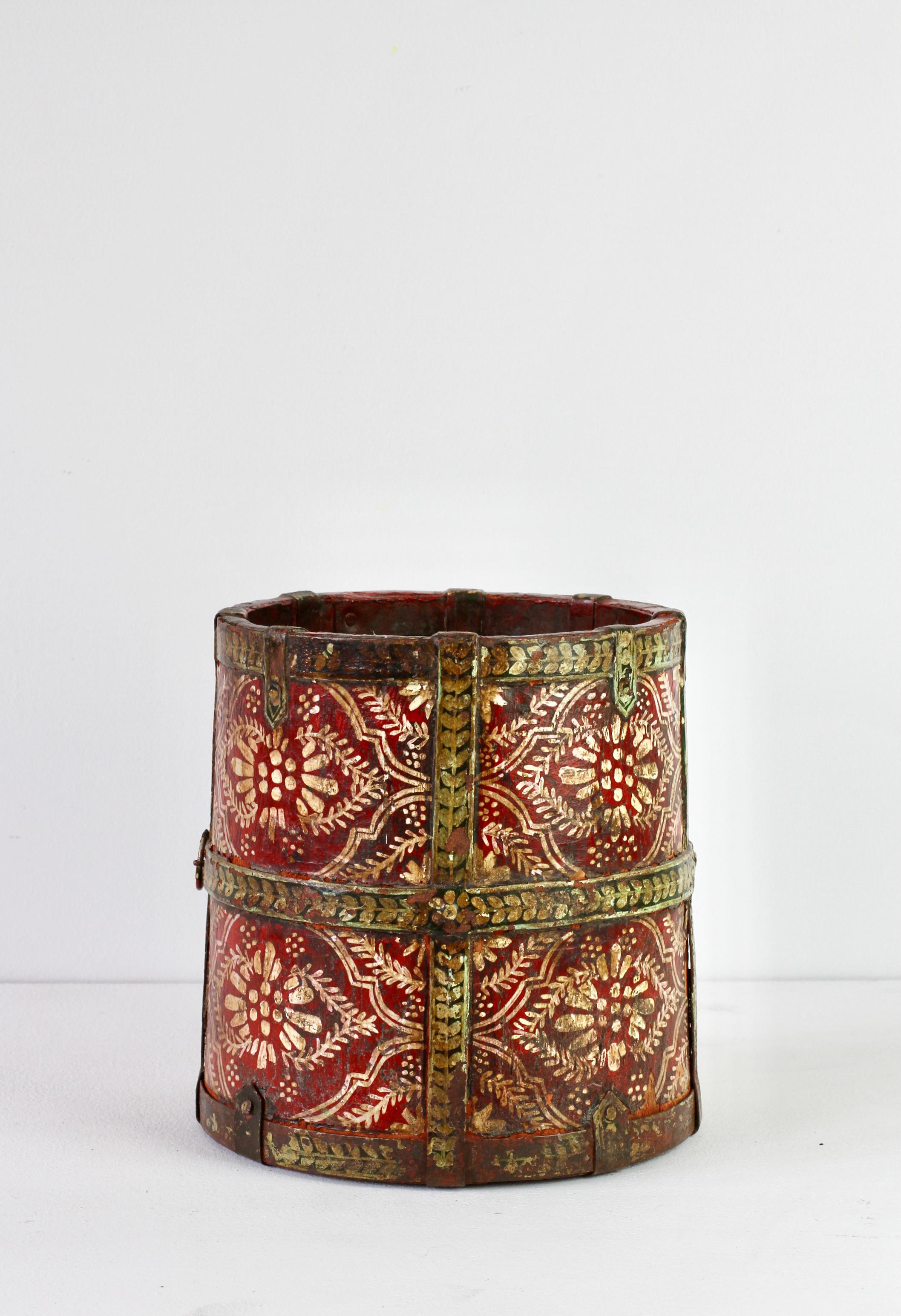 Really beautifully hand painted antique wooden bucket or furkil. Probably Scandinavian / European in origin and made of oak staves and wrought iron, circa 1850. We absolutely love the off white hand-painted decorations over the red base and the gold
