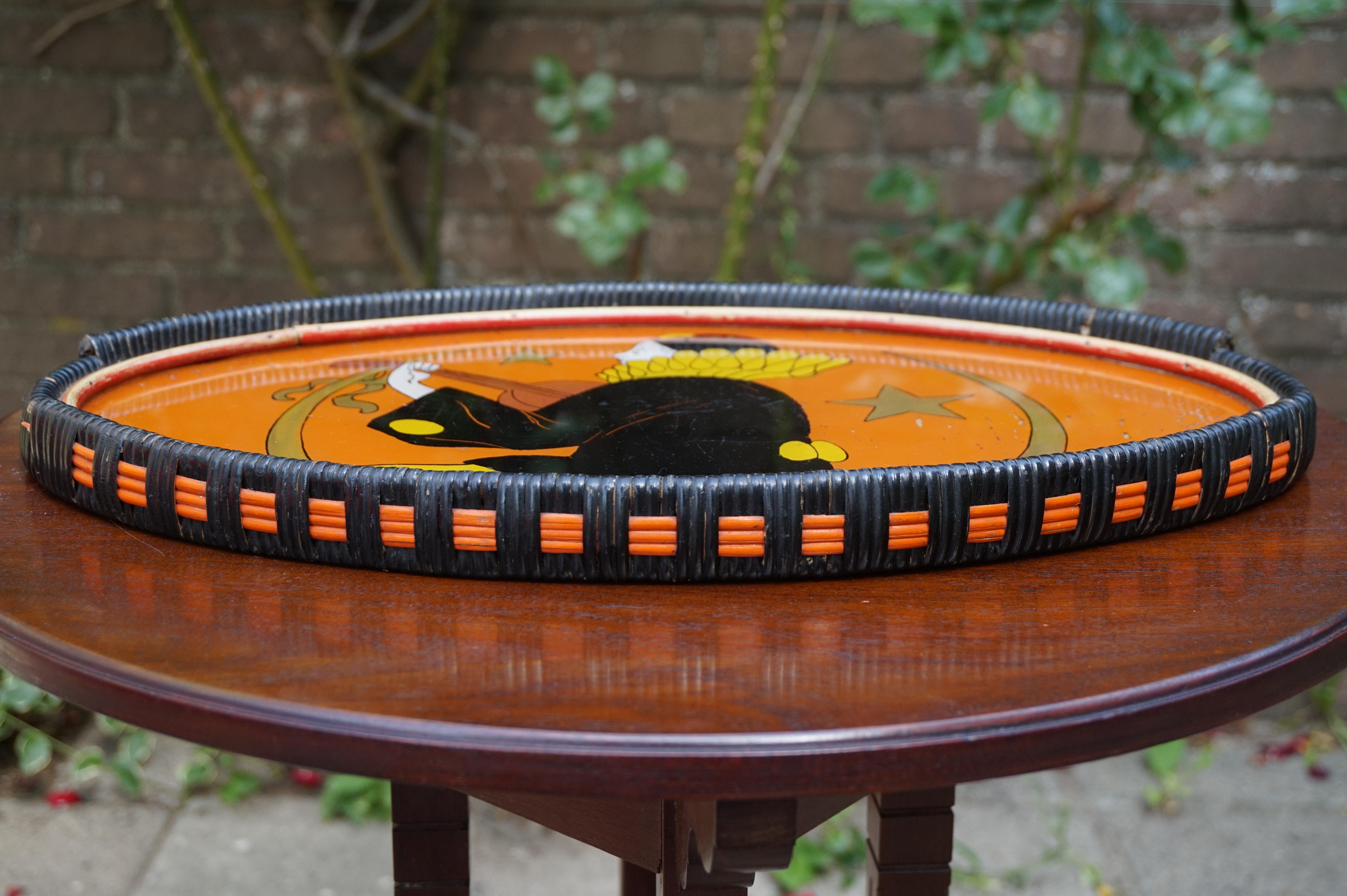 All handcrafted and vibrant Art Deco tray, signed Manon.

If you are looking for something special to decorate your table, dresser or credenza with then this mixed materials work of art from the 1930s Art Deco era could be perfect. The oval shape