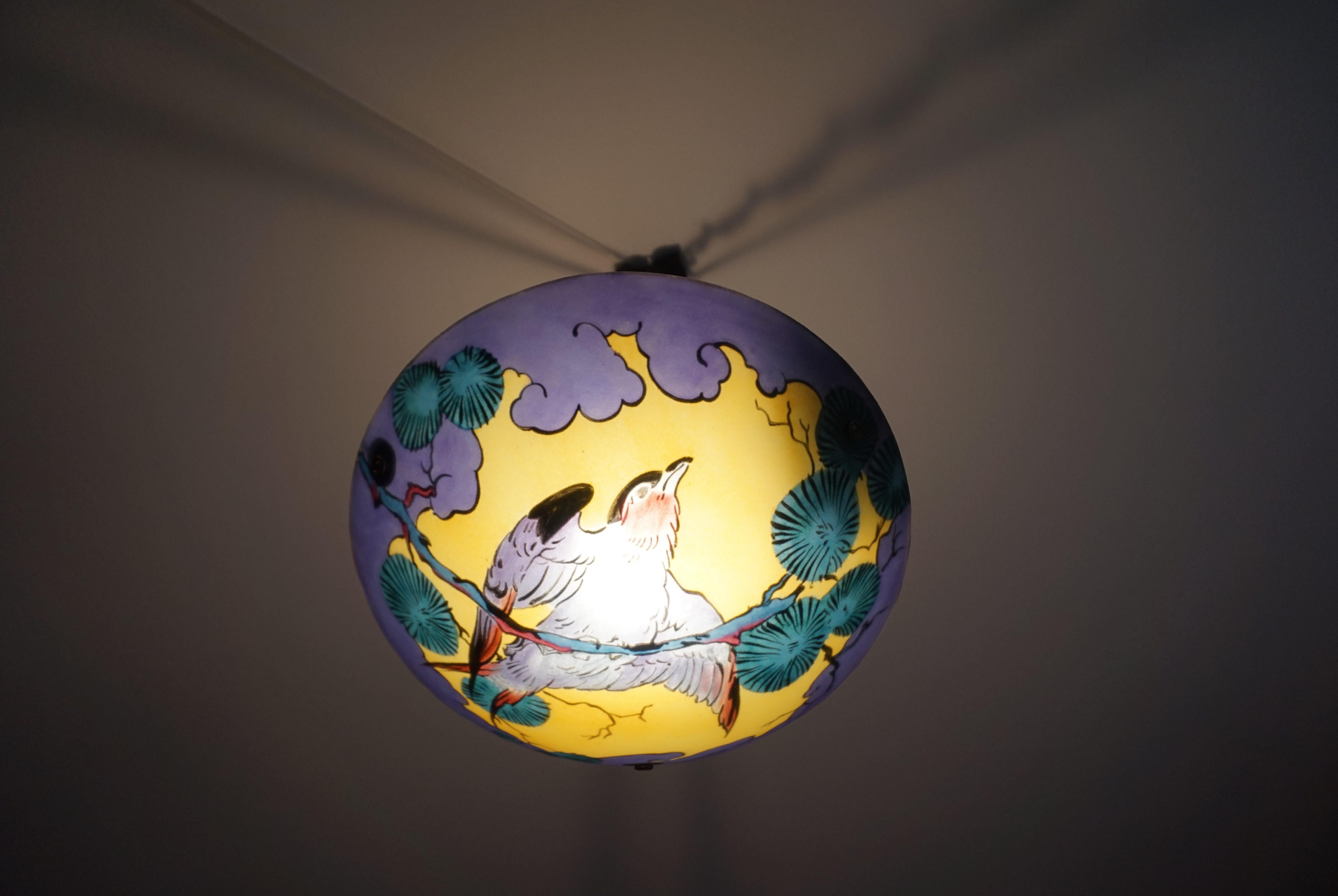 Unique and stunning work of lighting art, attributed to David Gueron a.k.a. Degué.

If you are passionate about early 20th century decorative art then you will love this striking pendant. What you are seeing here is a one of a kind, hand painted,