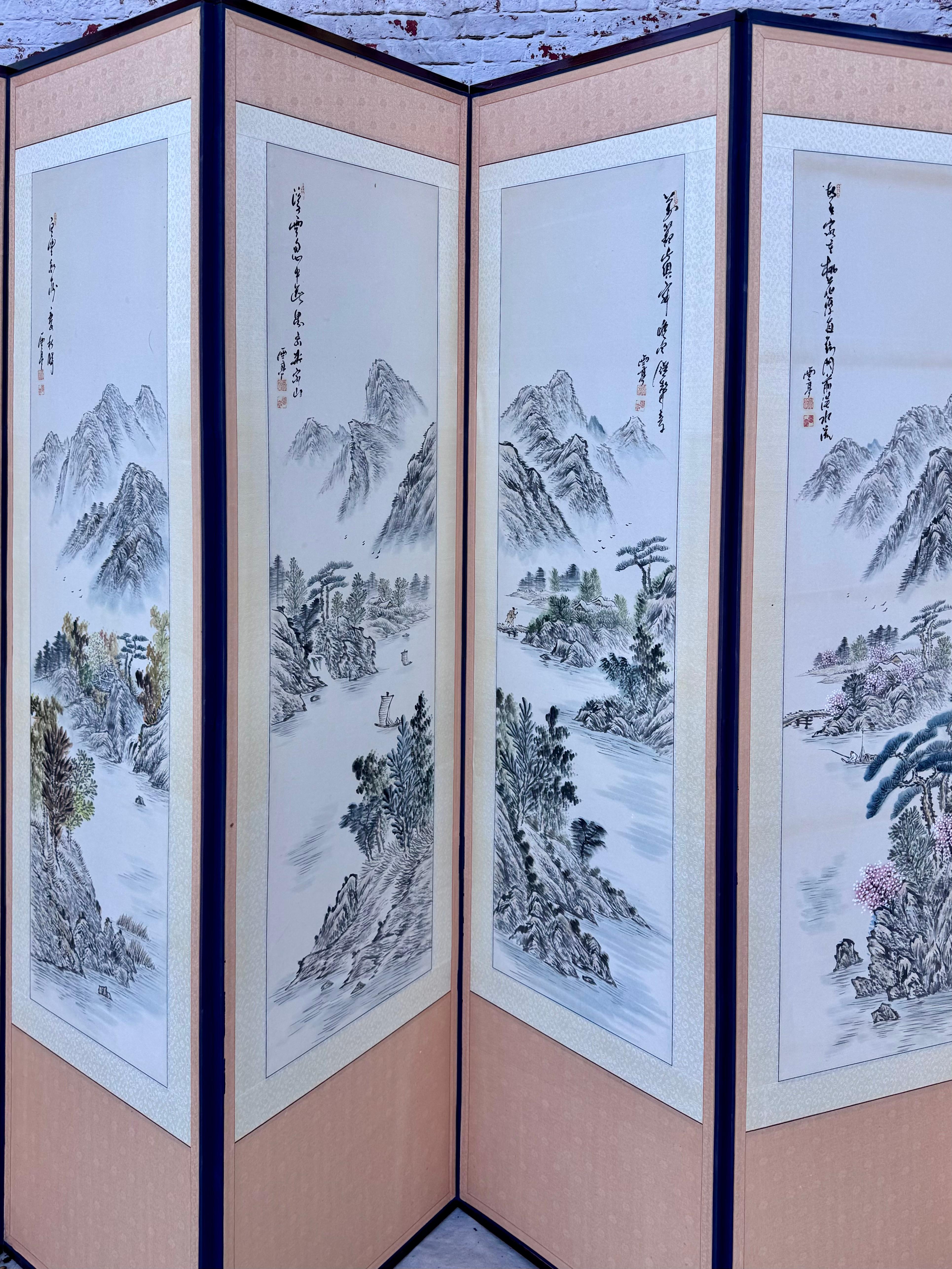 Mid 20th Century hand-painted Asian Screen/Room Divider, Eight Panels. Features intricate artwork on a series of panels connected by hinges. Painting are of serene landscapes with mountains and trees throughout, that provide a tranquil and