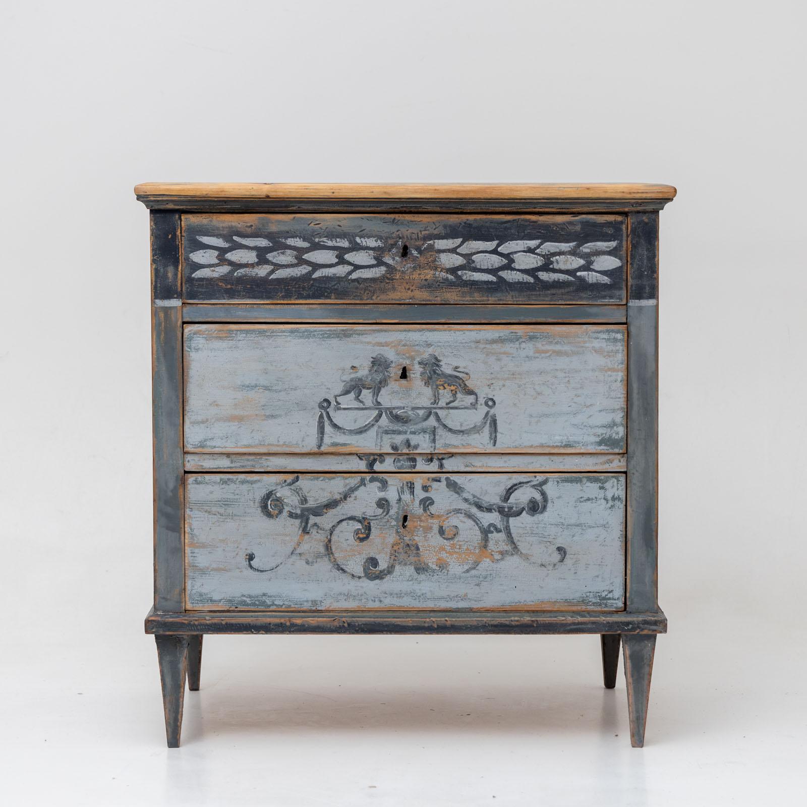 A small Biedermeier chest of drawers with three drawers and new painting. The blue setting is made according to historical models and has an antique patina.