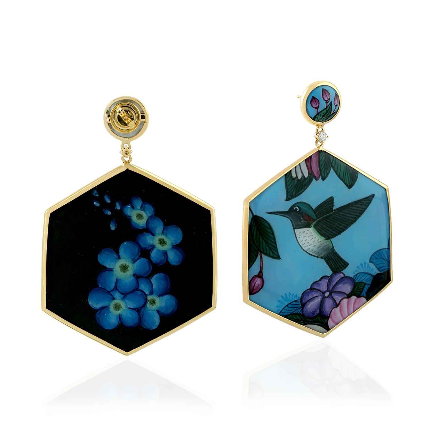 Sweet this hexagon shape Hand Painted Bird Bakelite Earring in 18k Yellow Gold is perfect for Mother's Day gift or any occasion.

18KT Gold: 6.190gms
Diamond: 0.15cts
MOP: 76.15cts
Enamel: 8.28gms
