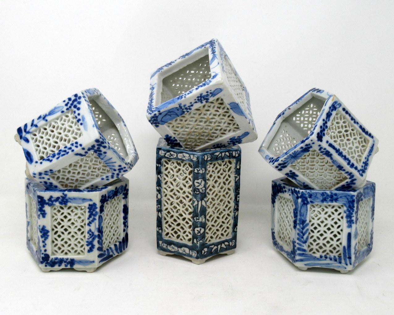 Stylish assembled set of six hand painted Chinese Export reticulated pierced blue and white porcelain vases of hexagonal and square outline, circa first half of the 20th century. 

Each finely hand decorated on all outer panels depicting flowers