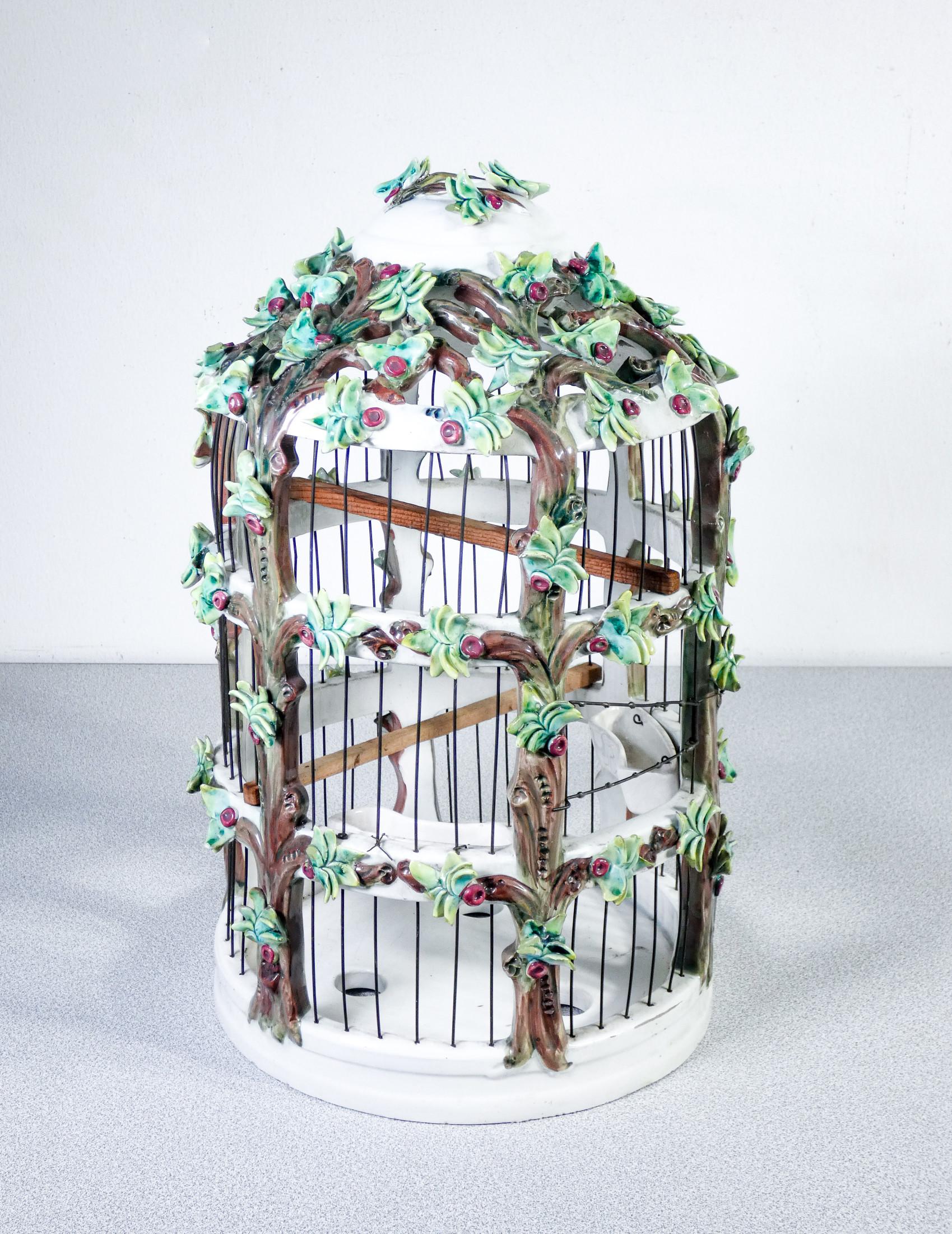 Unique hand painted ceramic
Aviary.
Italian manufacture

ORIGIN
Italy

PERIOD
Early twentieth century

MODEL
Aviary, bird cage

MATERIALS
Hand modeled
and painted ceramic

DIMENSIONS
H 42 cm
Ø 27 cm

CONDITIONS
The aviary is in